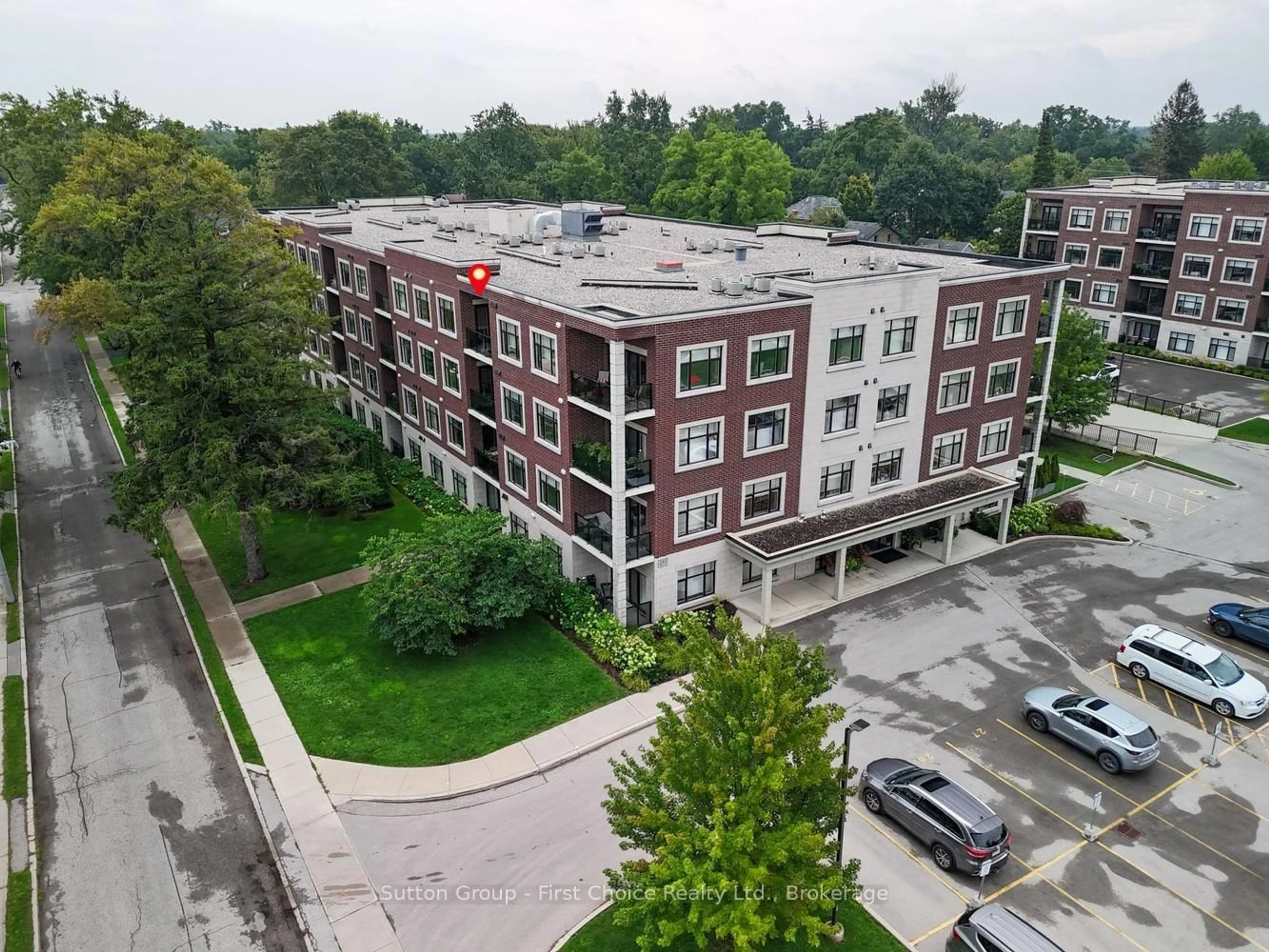 A pic from outside/outdoor area/front of a property/back of a property/a pic from drone, unknown for 255 JOHN St #412, Stratford Ontario N5A 0G7
