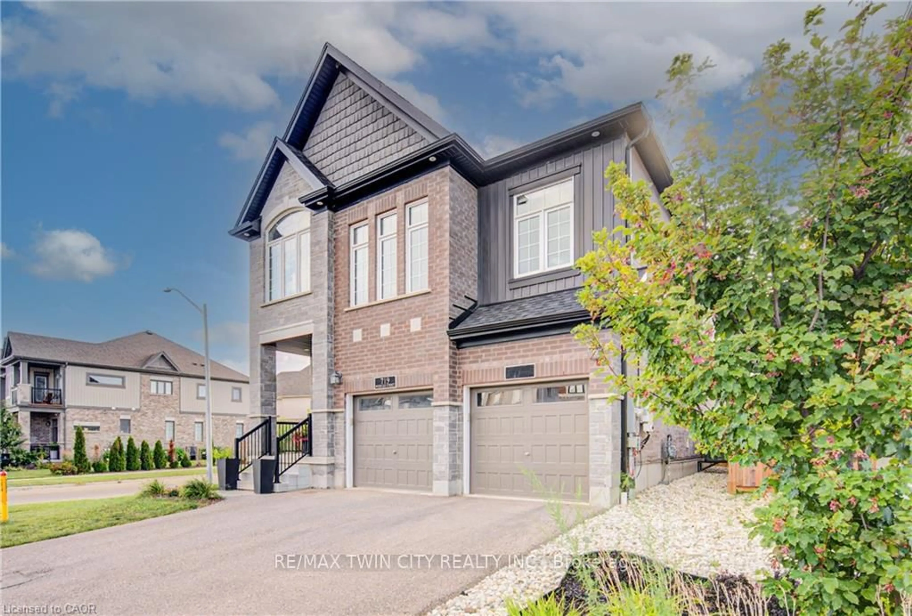 Home with brick exterior material, street for 719 Wood Lily St, Waterloo Ontario N2V 0G1