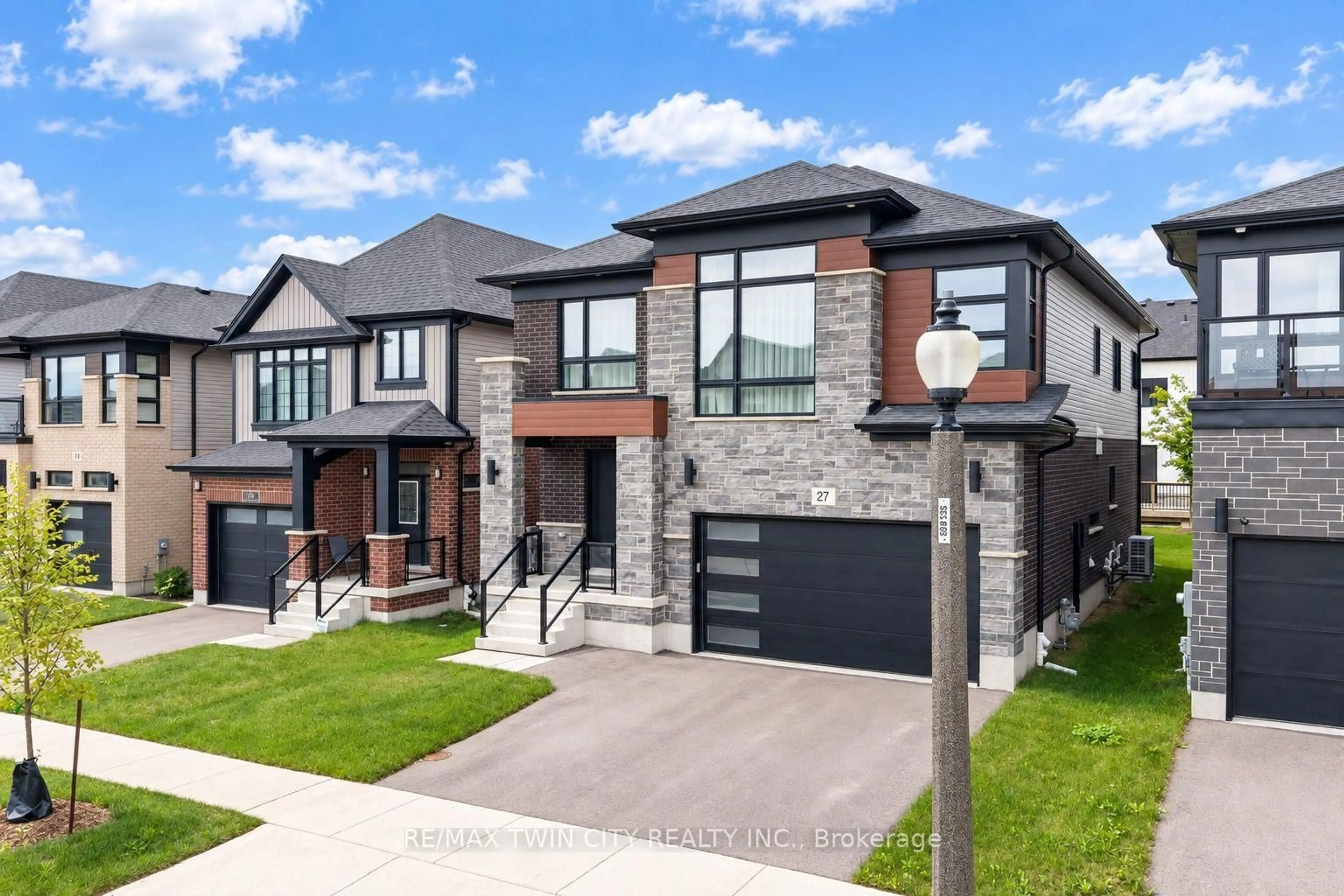 Home with brick exterior material, street for 27 Jacob Detweiller Dr, Kitchener Ontario N2P 0K7