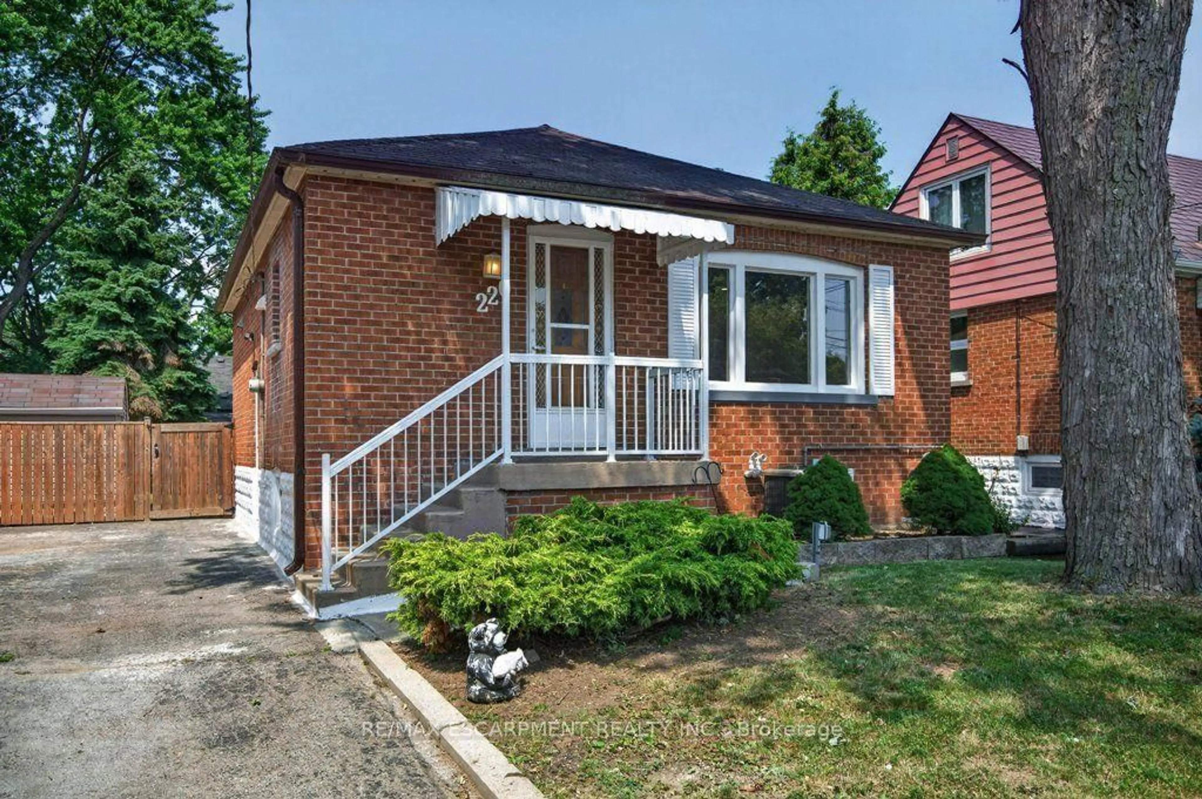 Home with brick exterior material, street for 220 EAST 13TH St, Hamilton Ontario L9A 3Z7