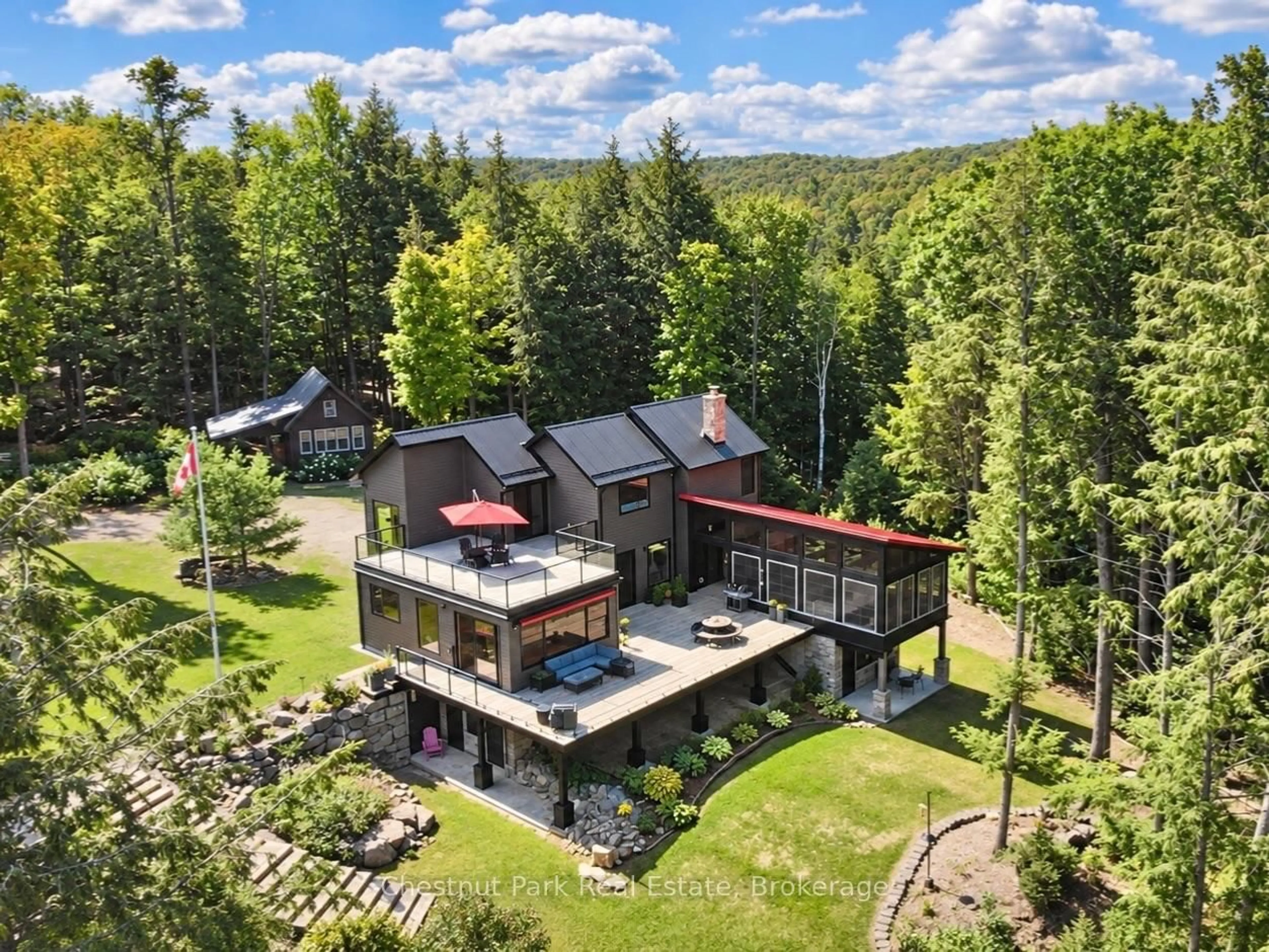 A pic from outside/outdoor area/front of a property/back of a property/a pic from drone, mountain view for 1304 Grandpa's Tr, Highlands East Ontario K0M 2K0