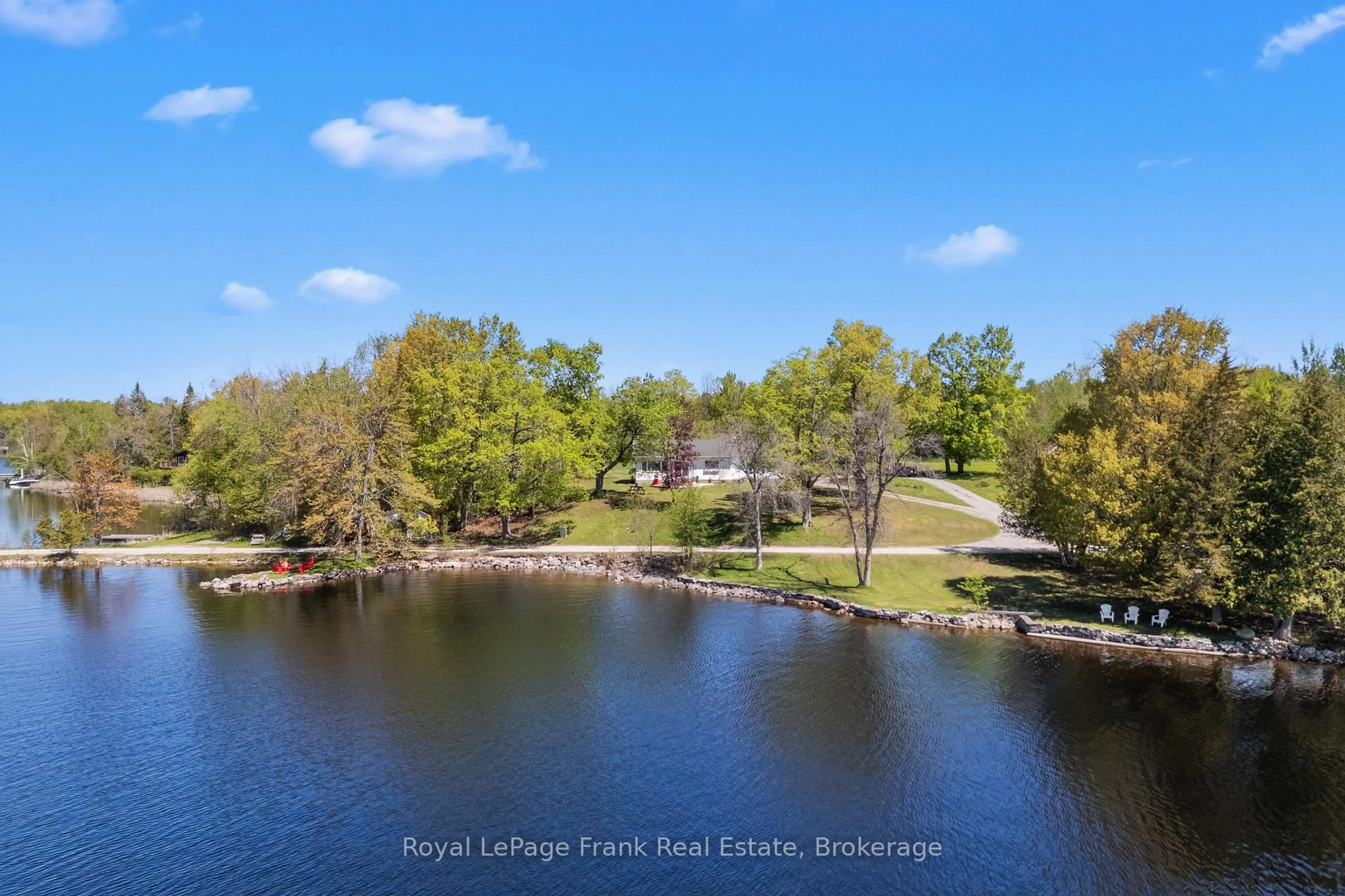 A pic from outside/outdoor area/front of a property/back of a property/a pic from drone, water/lake/river/ocean view for 39 Fire Route 98 Rte, Trent Lakes Ontario K0M 1A0