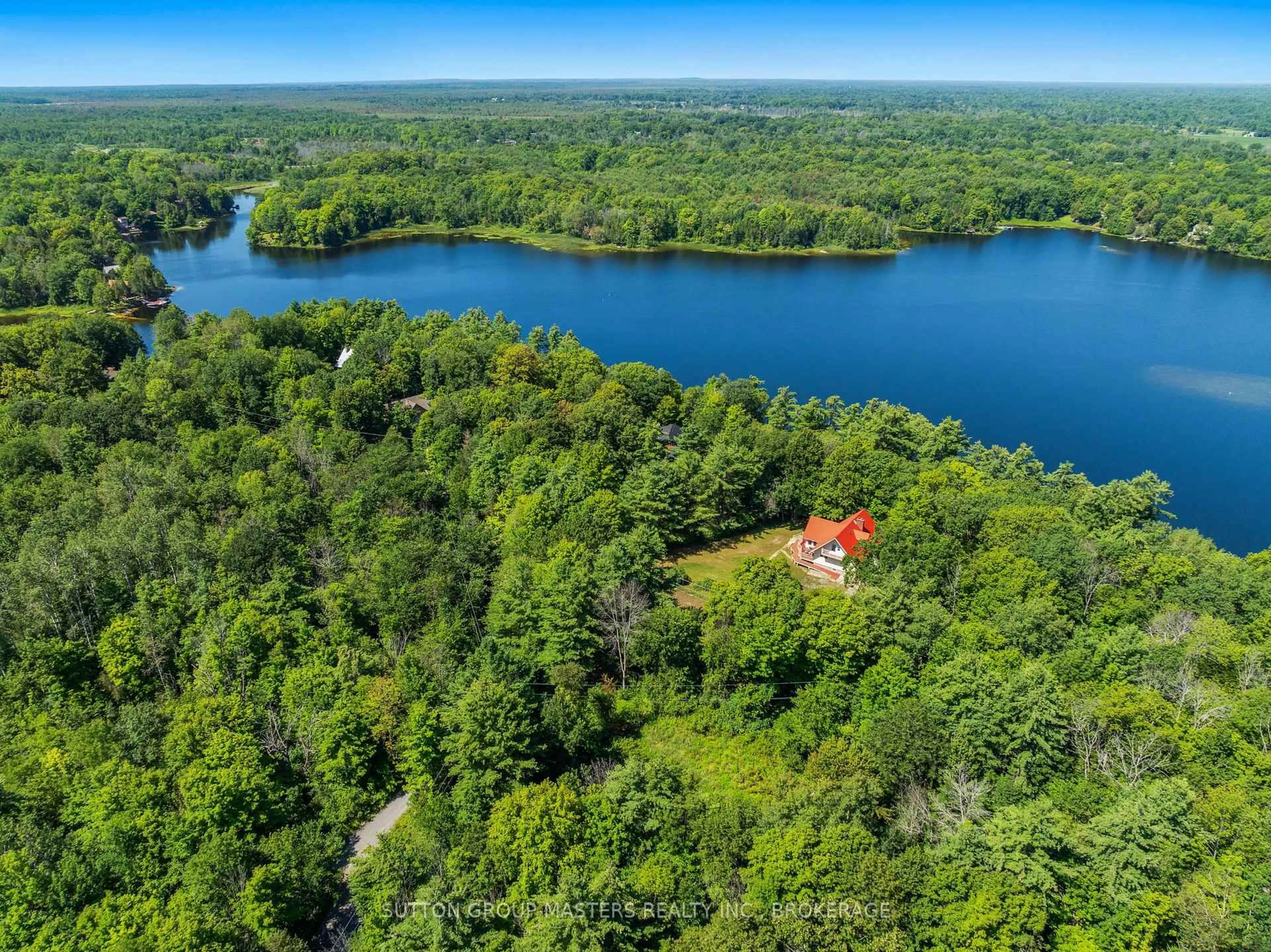 A pic from outside/outdoor area/front of a property/back of a property/a pic from drone, water/lake/river/ocean view for 3659 Moore Farm Lane, Hartington Ontario K0H 1W0