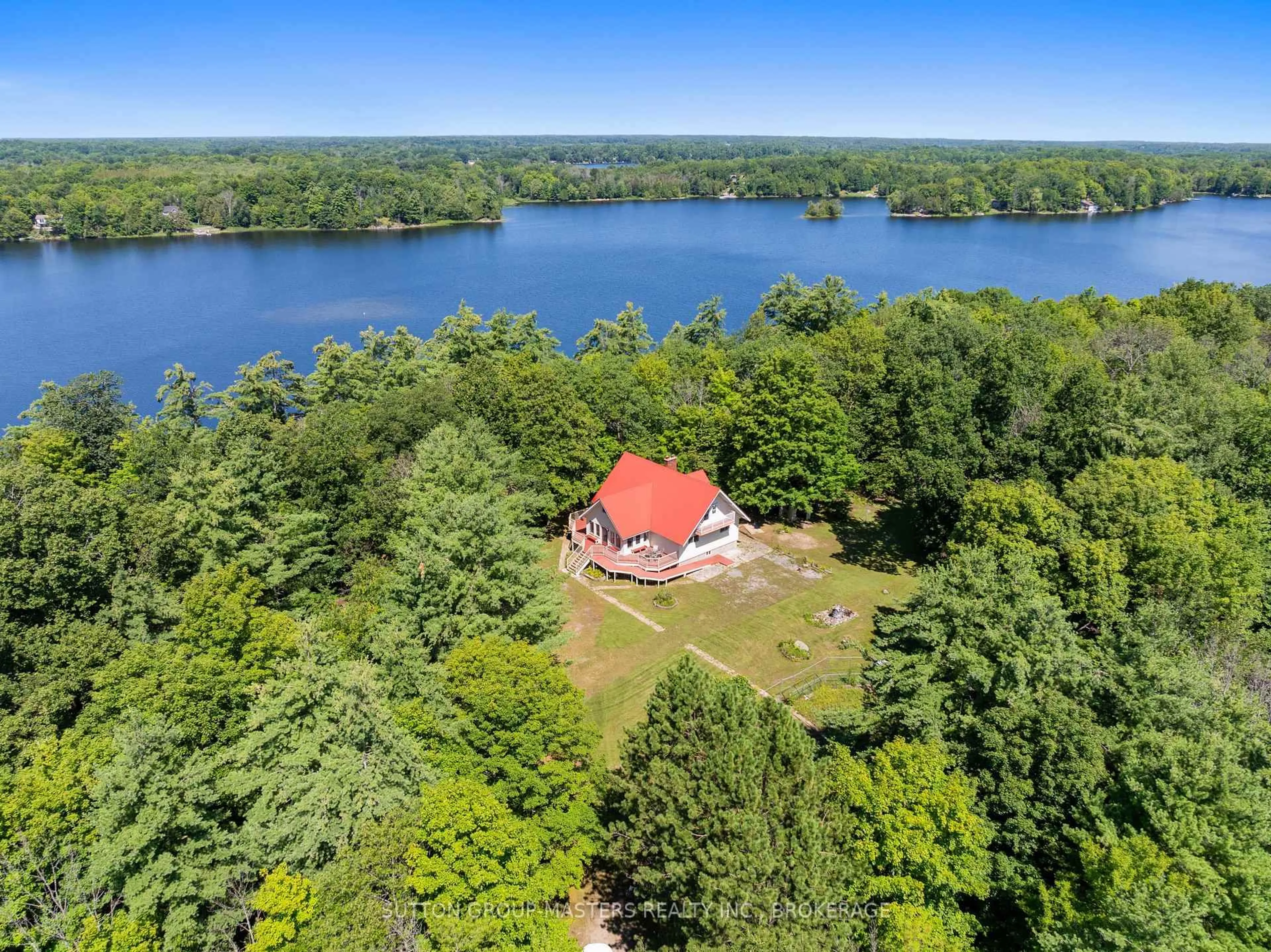 A pic from outside/outdoor area/front of a property/back of a property/a pic from drone, water/lake/river/ocean view for 3659 Moore Farm Lane, Hartington Ontario K0H 1W0