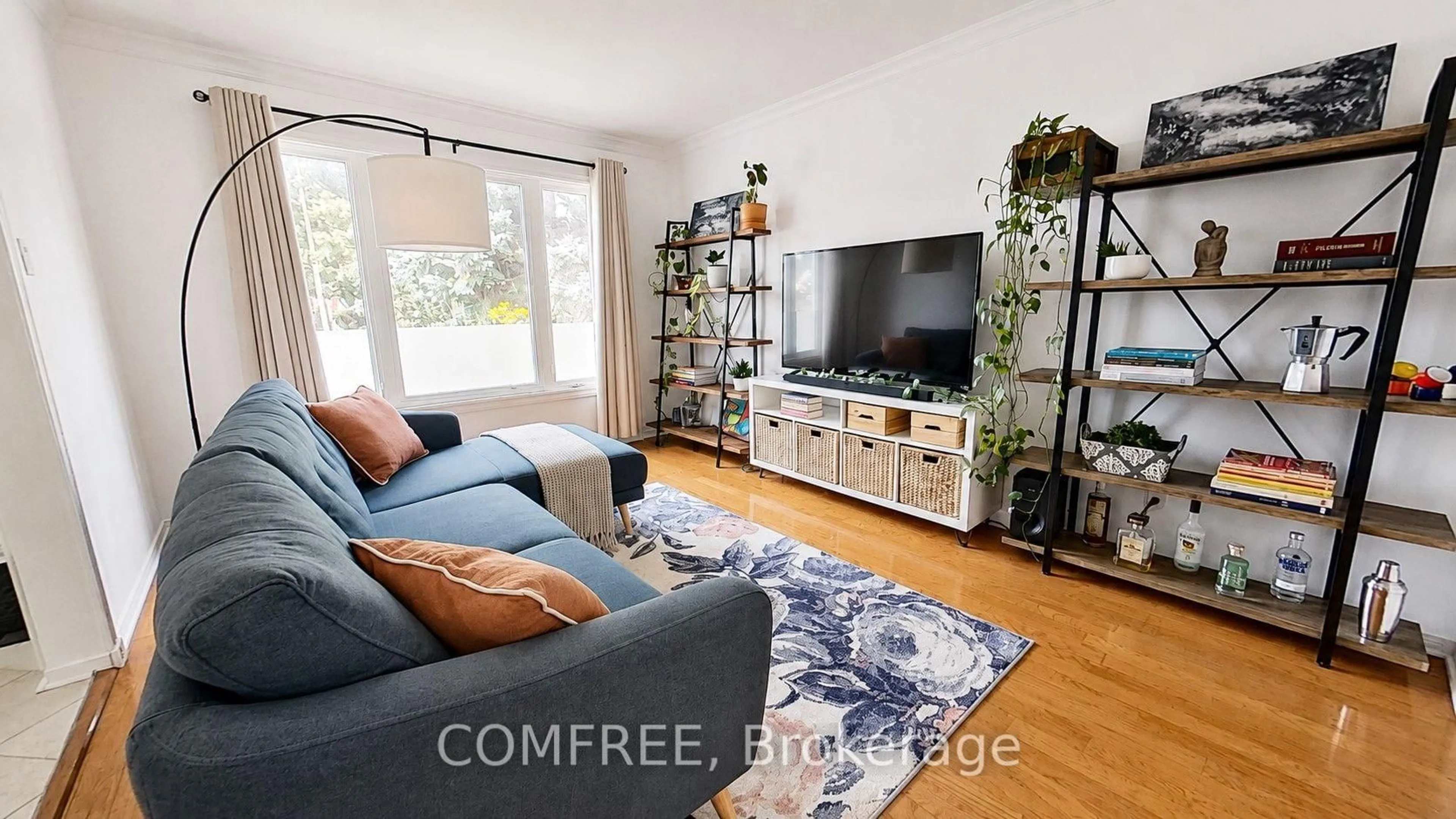 Living room with furniture, wood/laminate floor for 1302 Parc Du Village St, Orleans Ontario K1C 7B1