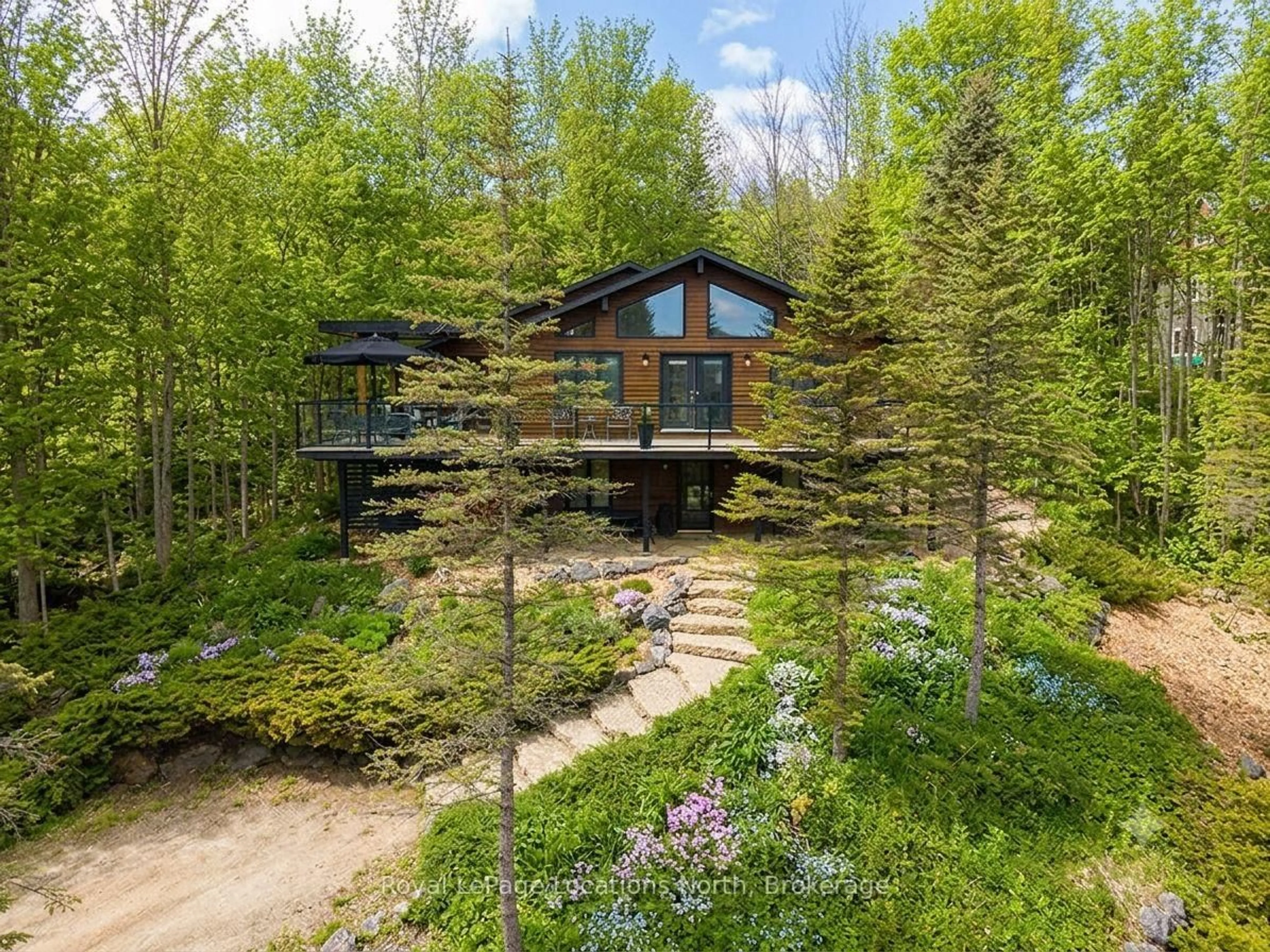 A pic from outside/outdoor area/front of a property/back of a property/a pic from drone, forest/trees view for 112 Amik Crt, Grey Highlands Ontario N0C 1G0