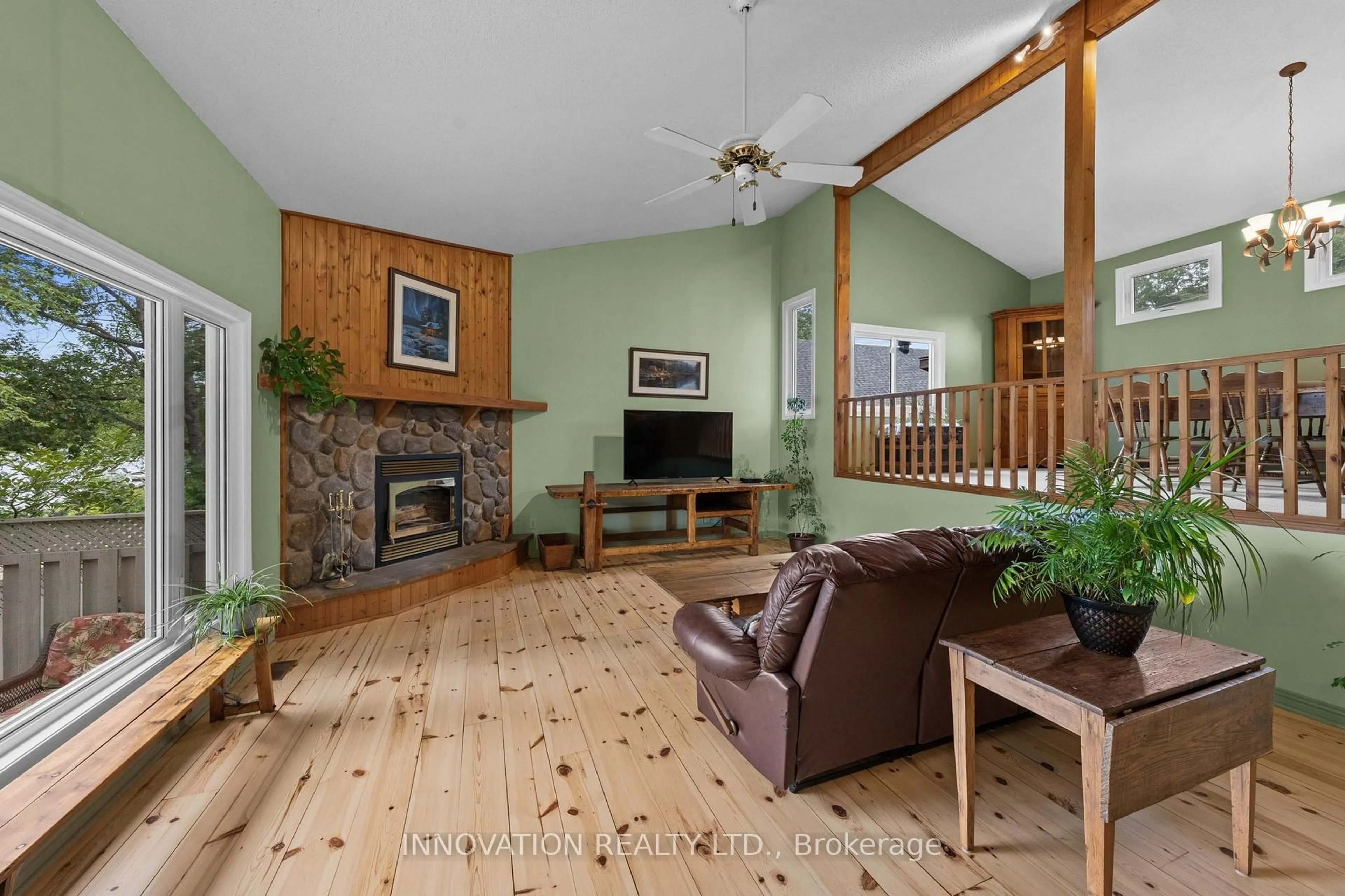 Living room with furniture, wood/laminate floor for 956 Bayview Dr, Ottawa Ontario K0A 3M0