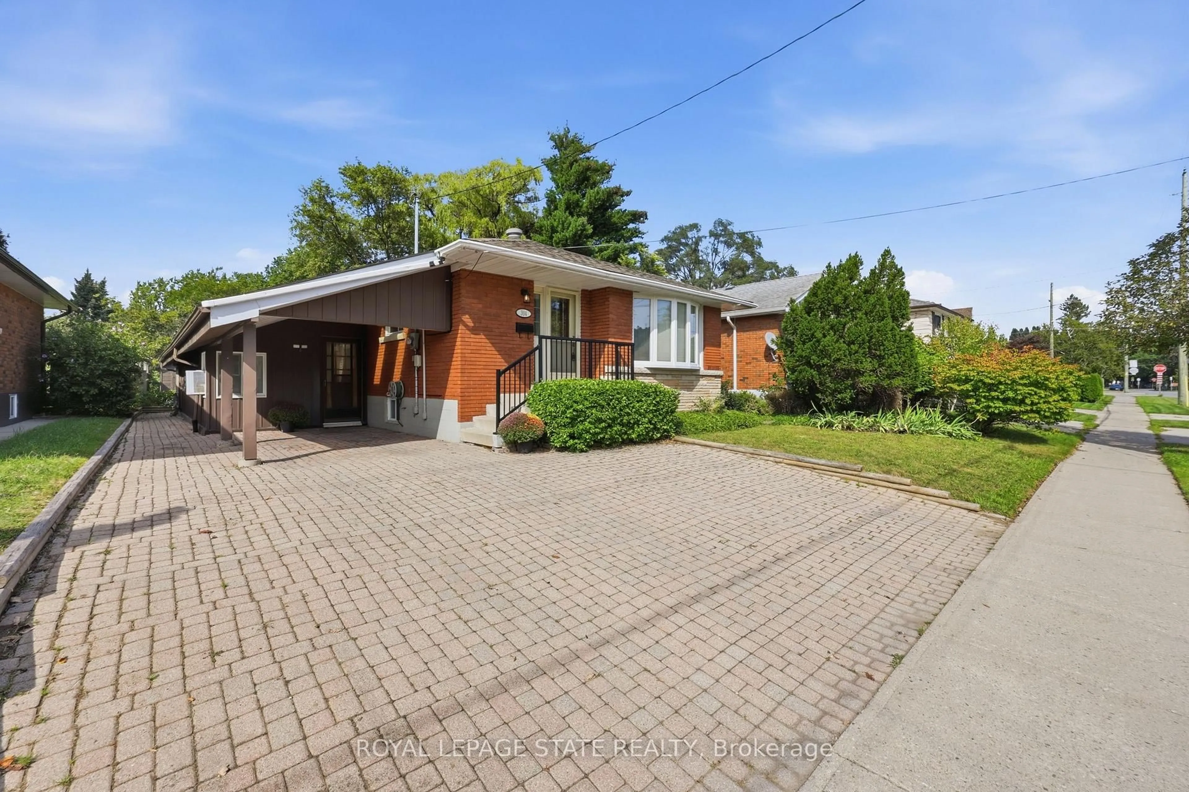 Home with brick exterior material, street for 304 Whitney Ave, Hamilton Ontario L8S 2H2