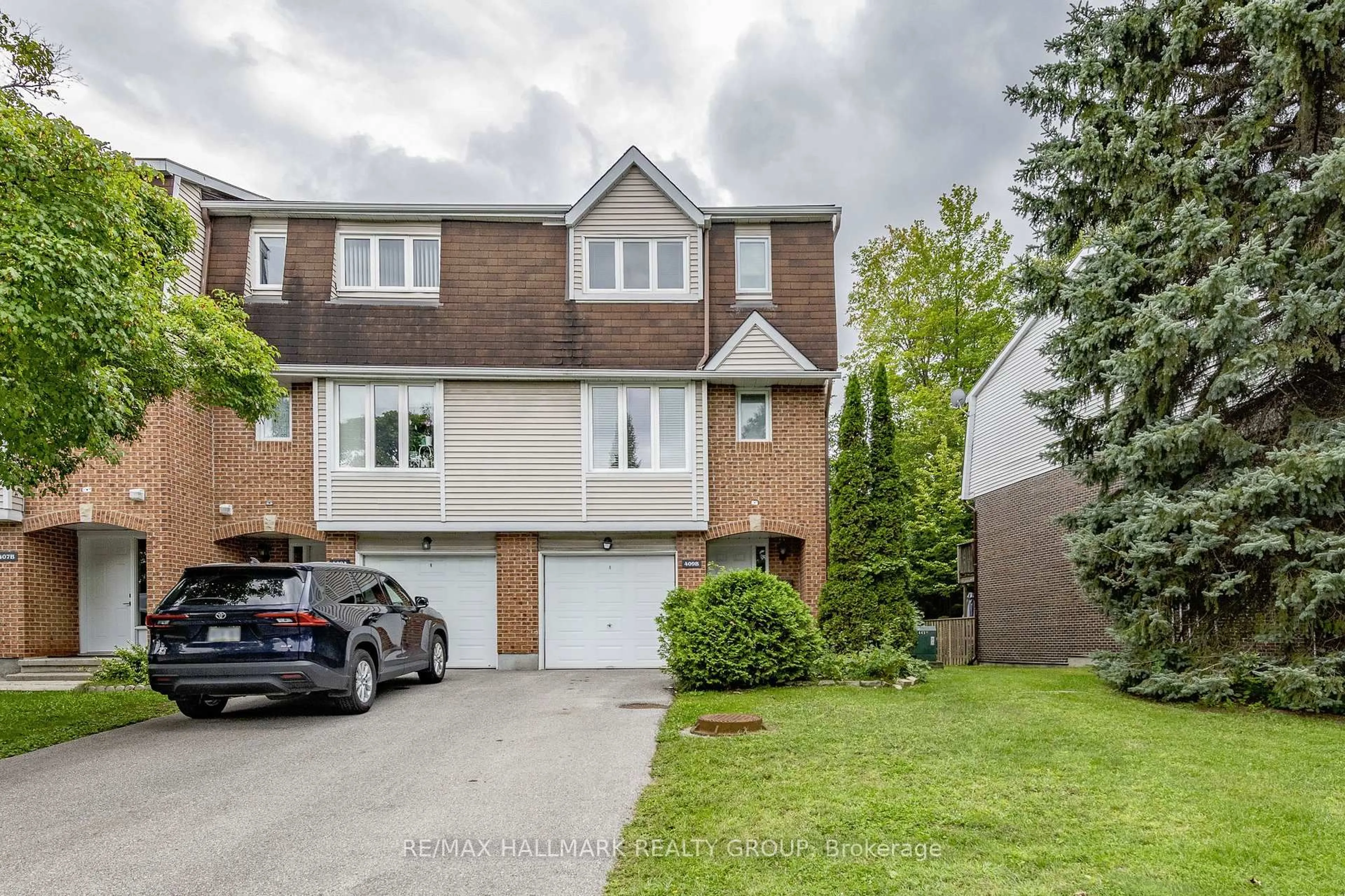 Home with brick exterior material, street for 409 Pickford Dr #B, Ottawa Ontario K2L 3P8