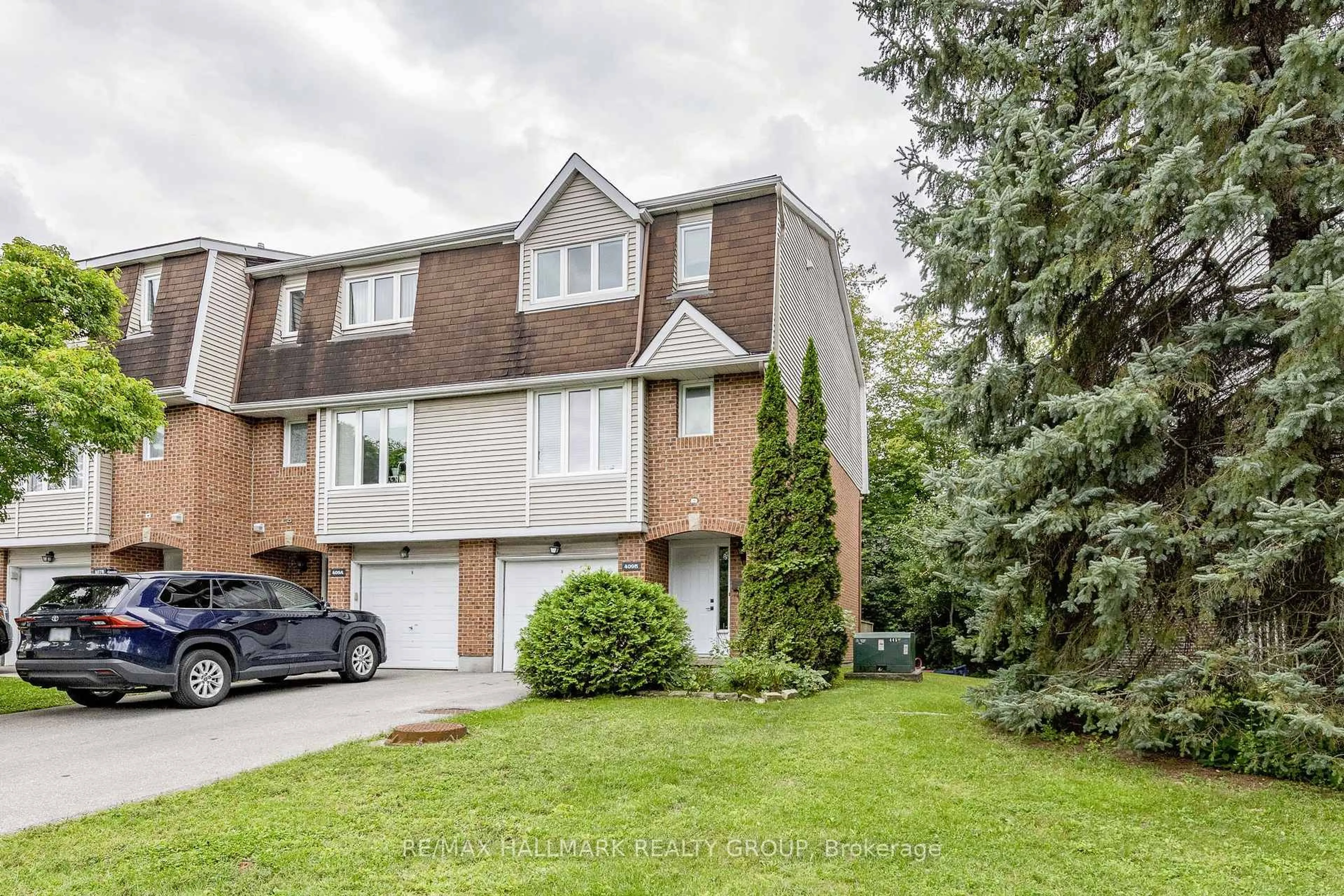Home with brick exterior material, street for 409 Pickford Dr #B, Ottawa Ontario K2L 3P8
