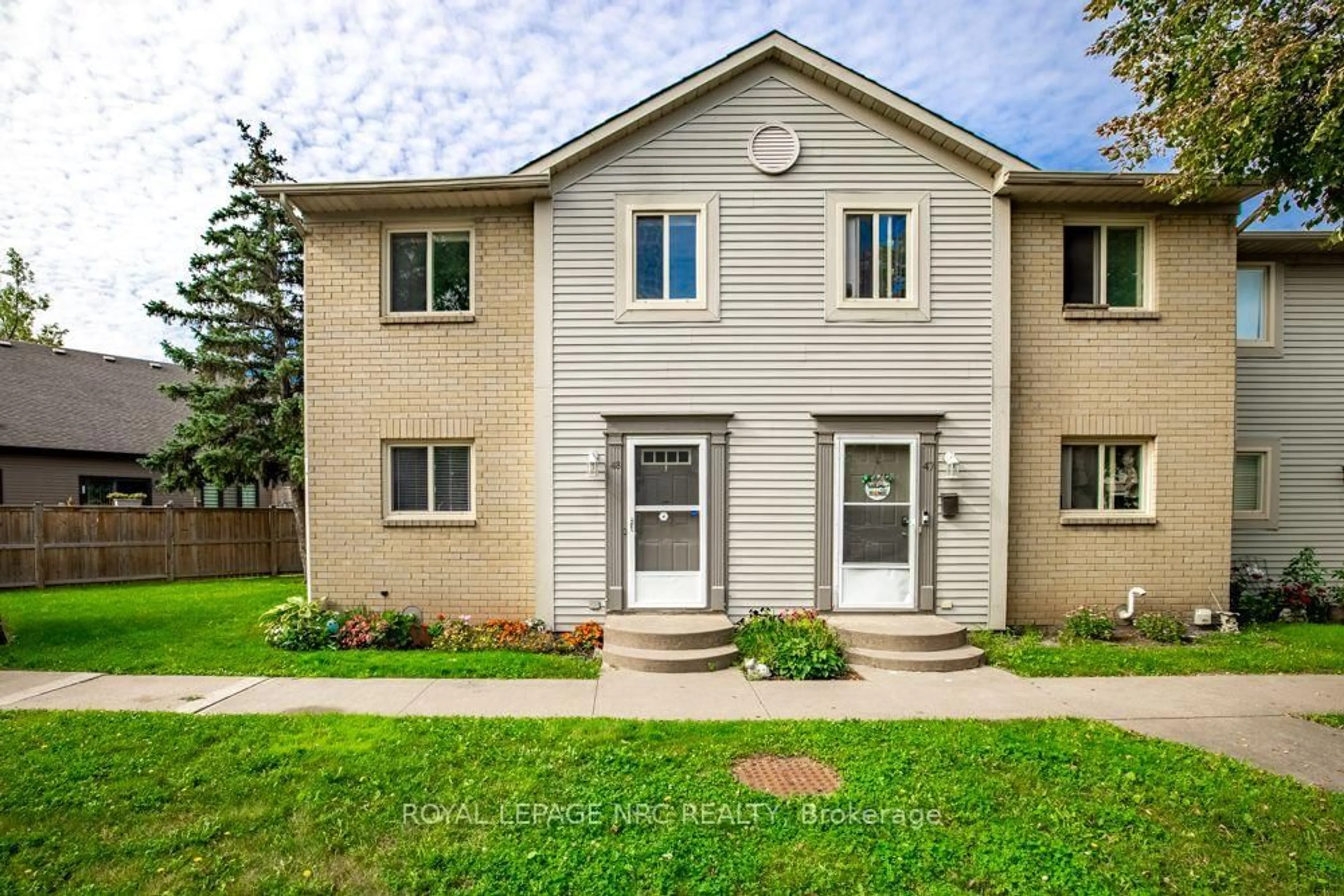 Home with vinyl exterior material, street for 65 Dorchester Blvd #48, St. Catharines Ontario L2M 7T7