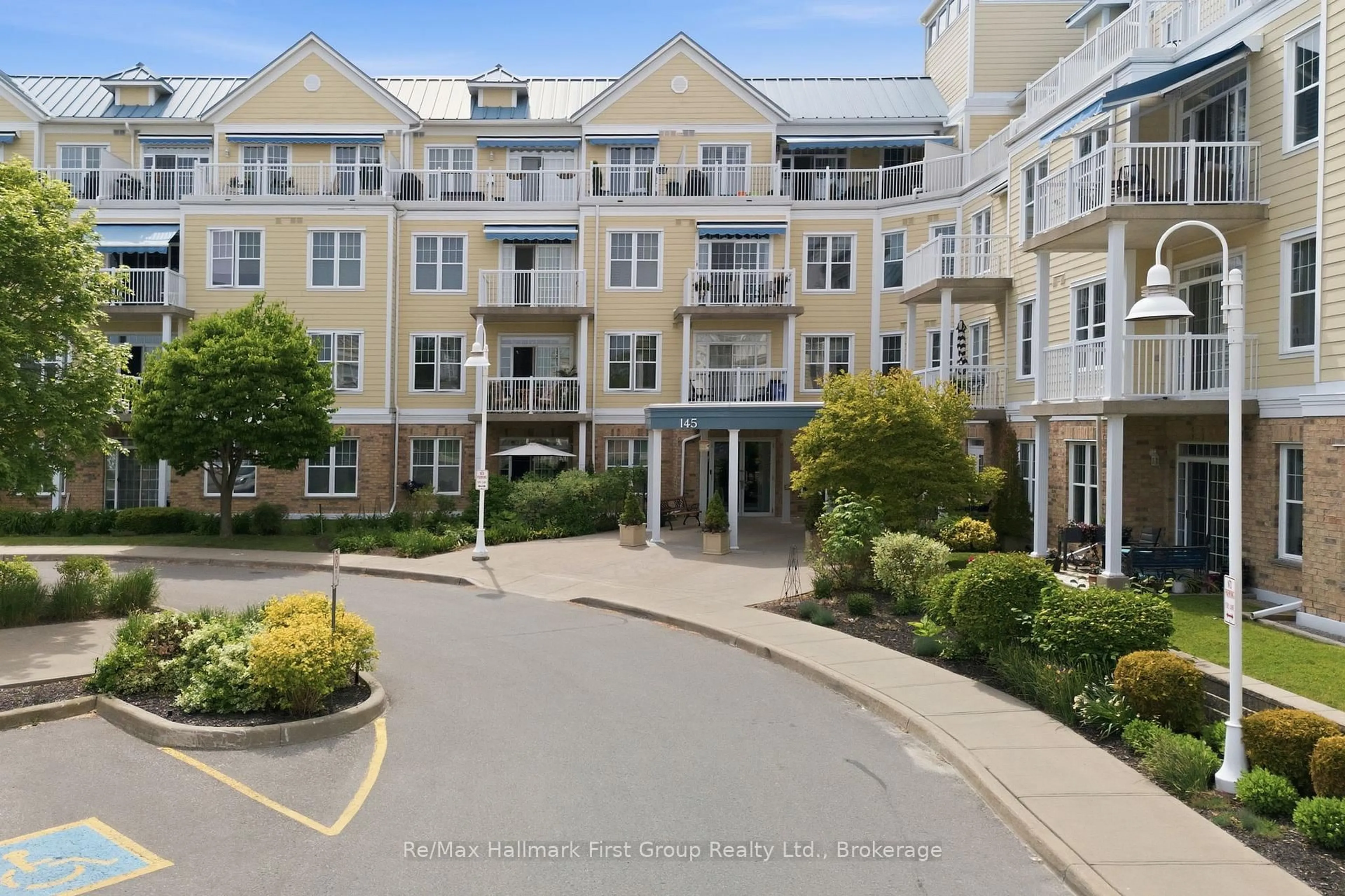 A pic from outside/outdoor area/front of a property/back of a property/a pic from drone, water/lake/river/ocean view for 145 Third St #215, Cobourg Ontario K9A 5X1