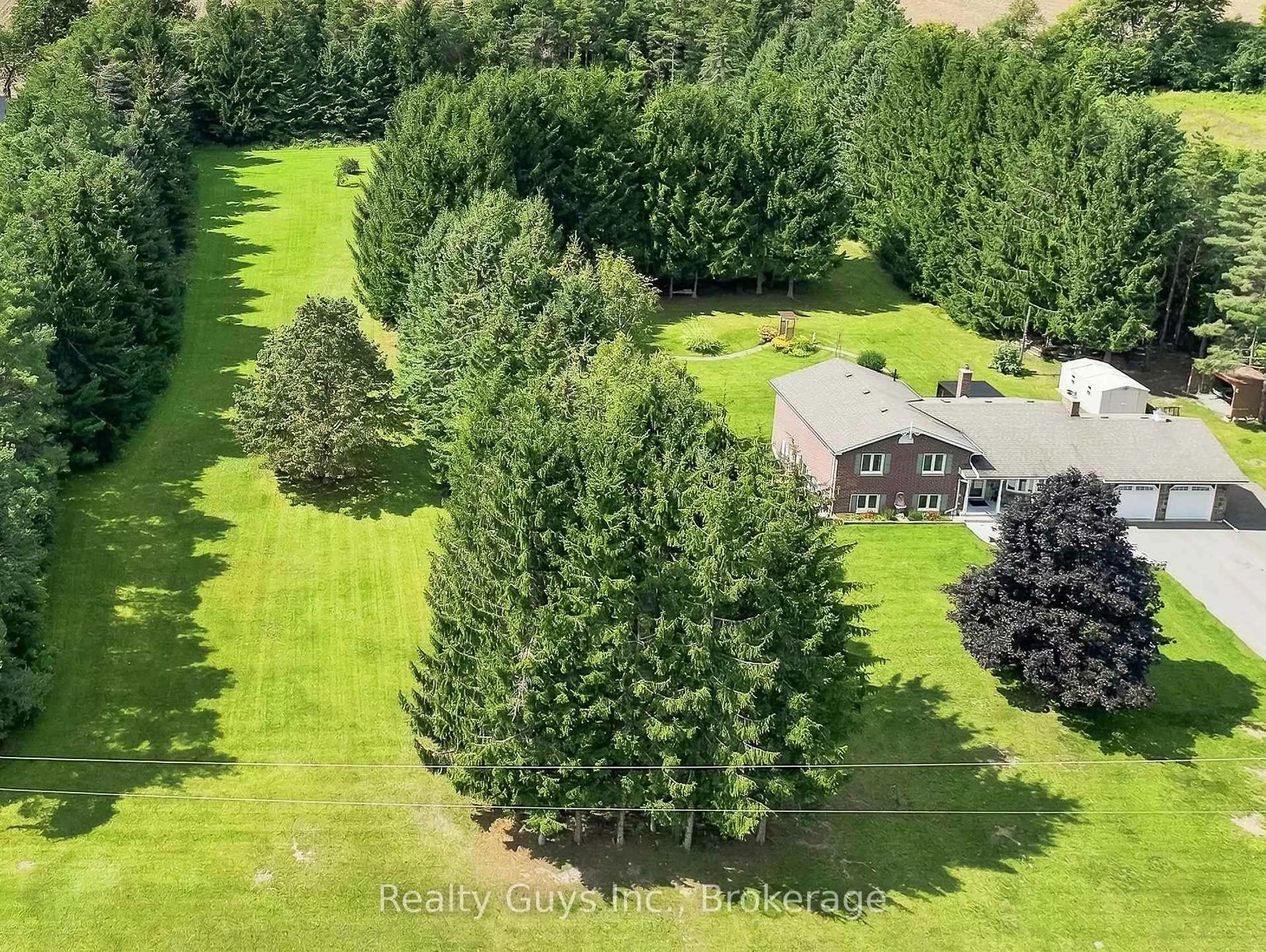 A pic from outside/outdoor area/front of a property/back of a property/a pic from drone, forest/trees view for 498 Ava Cres, Cavan Monaghan Ontario L0A 1G0