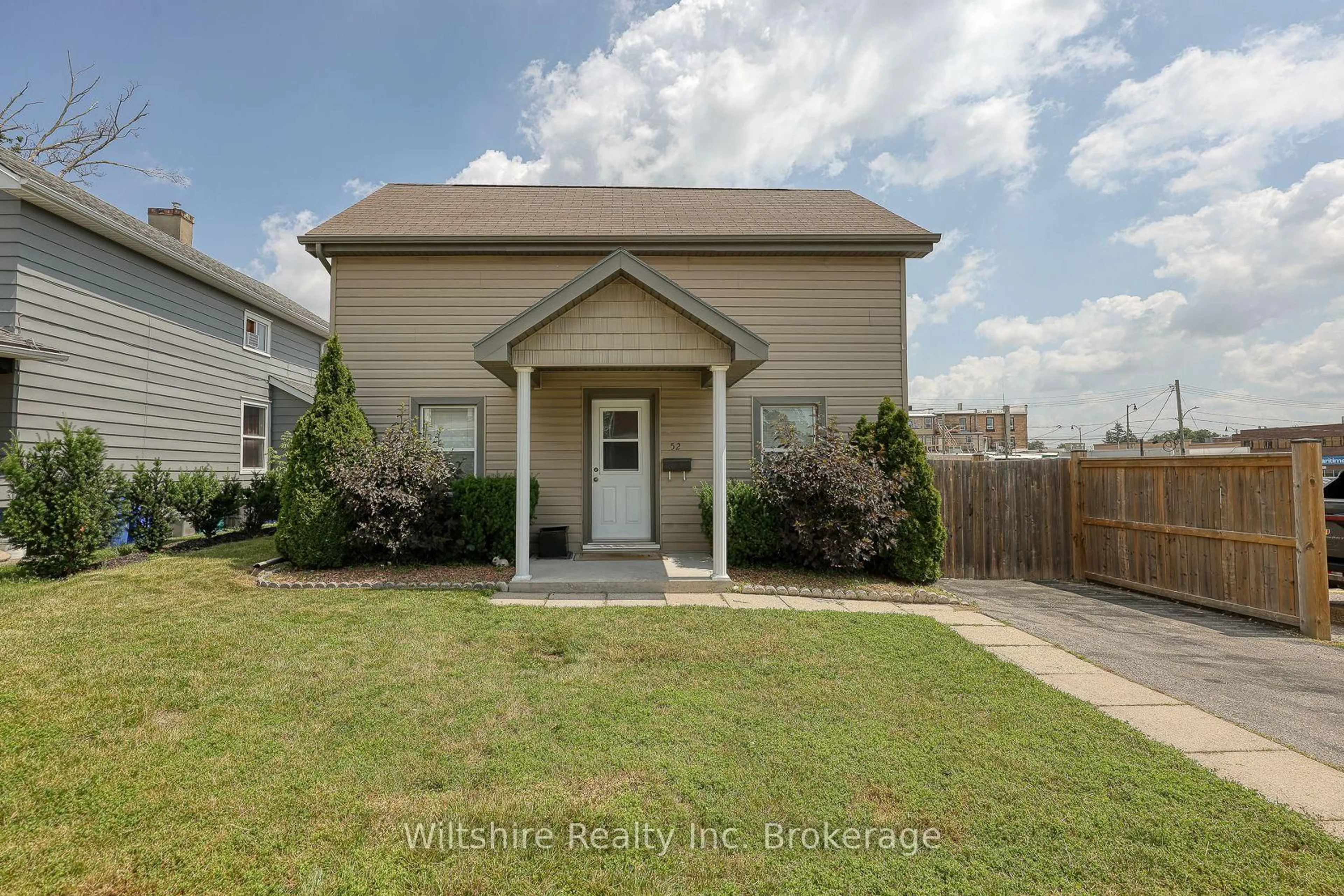 Home with vinyl exterior material, street for 52 Bidwell St, Tillsonburg Ontario N4G 3T7