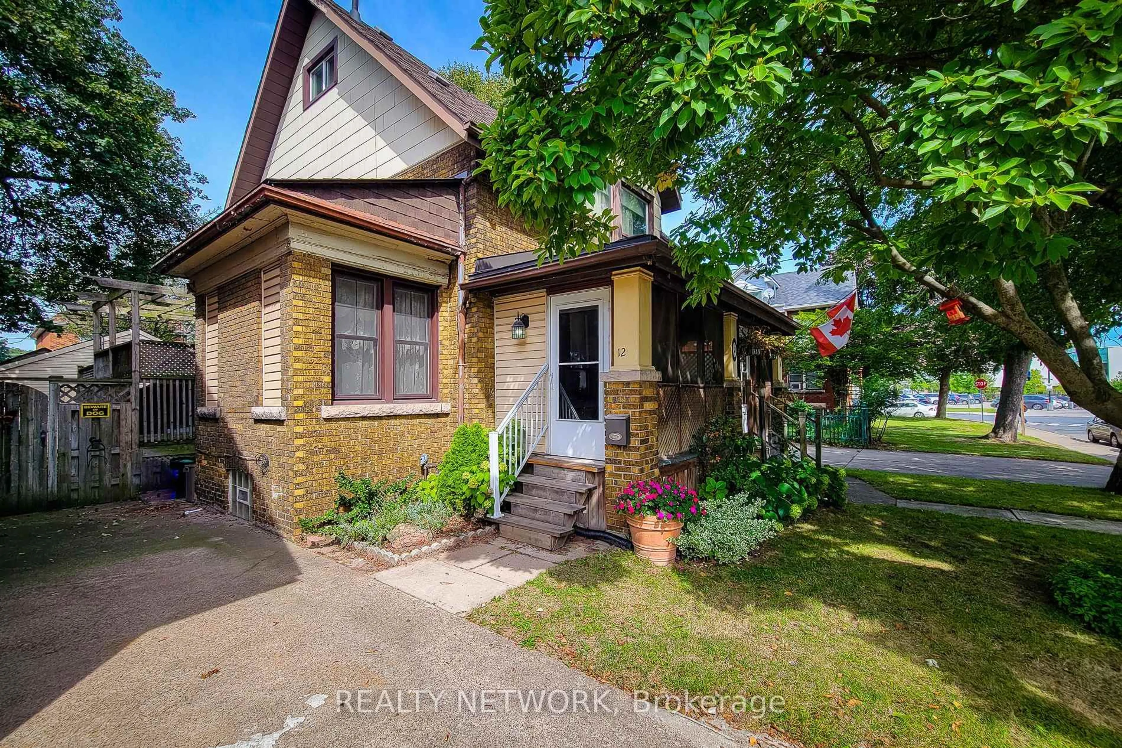 Home with brick exterior material, street for 12 Leinster Ave, Hamilton Ontario L8M 3A1