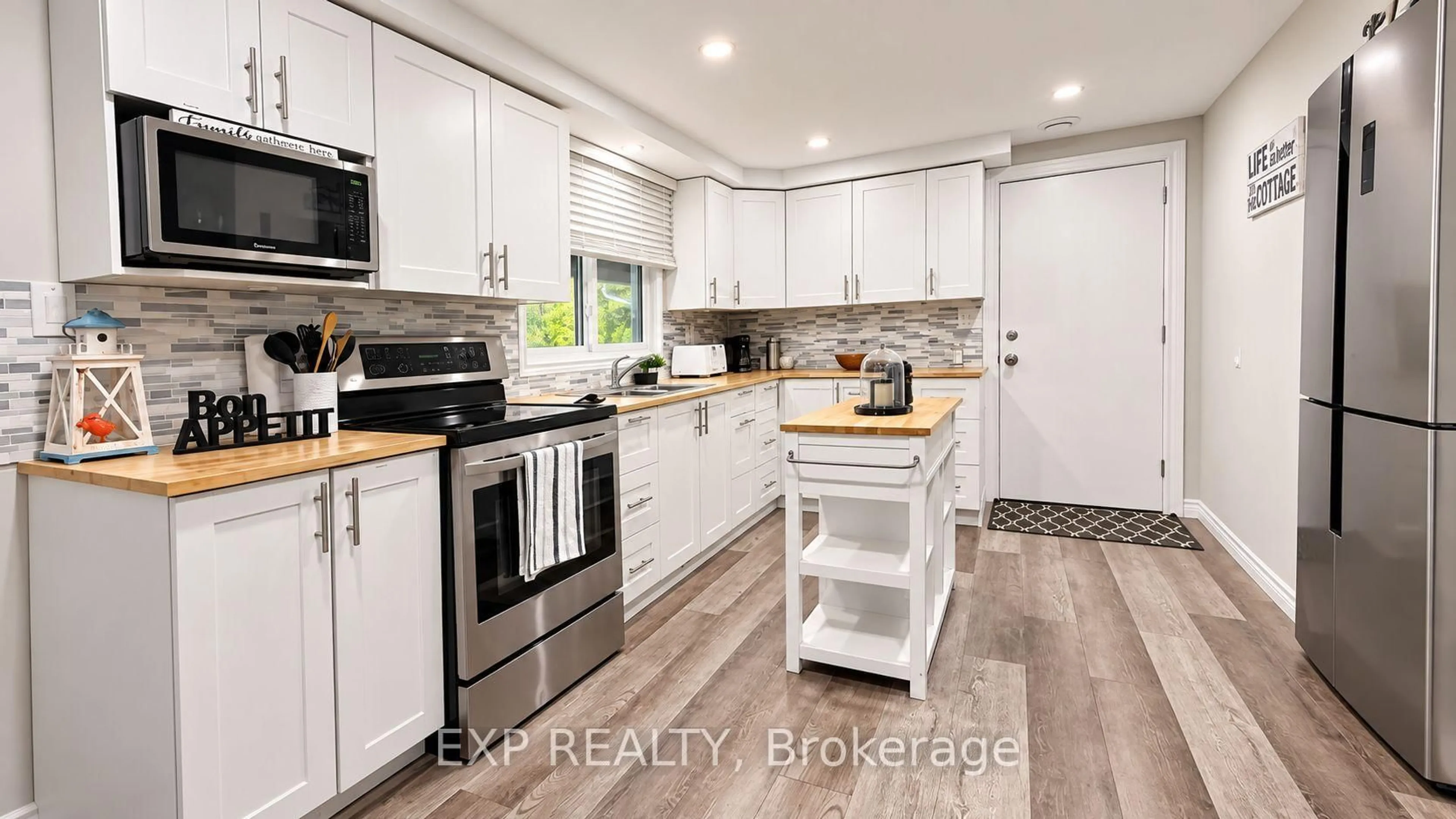 Open concept kitchen, wood/laminate floor for 9 Charlotte Cres, Kawartha Lakes Ontario K0L 2W0