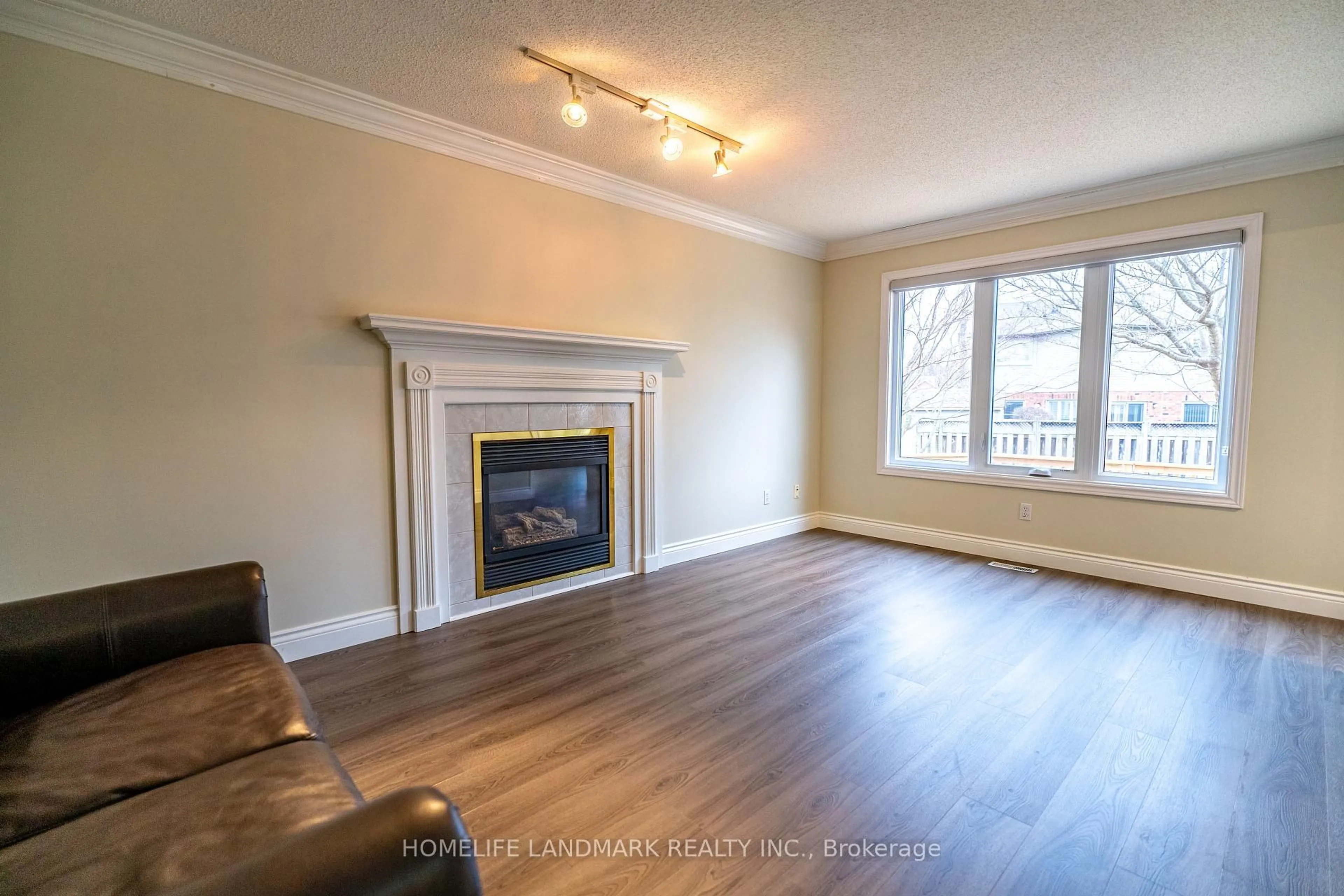 Living room with furniture, wood/laminate floor for 134 Moraine Crt, London North Ontario N6G 4Z1