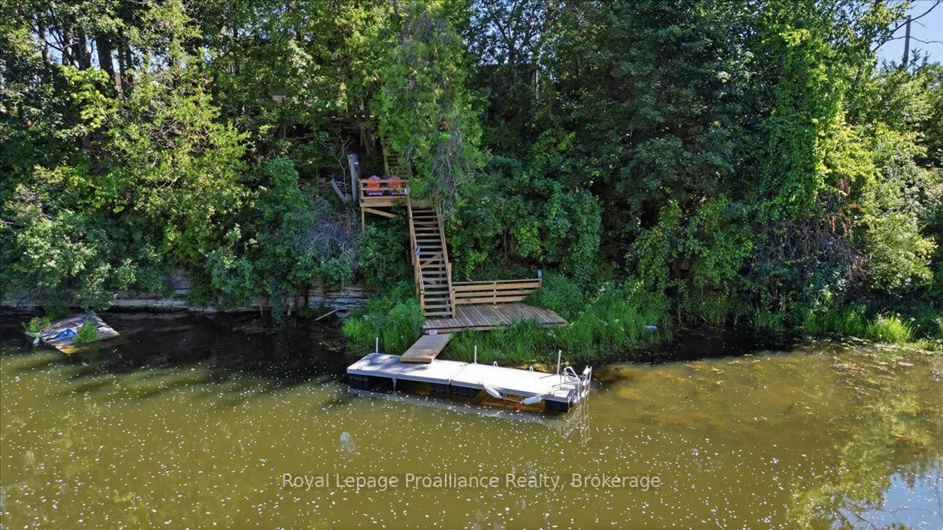 A pic from outside/outdoor area/front of a property/back of a property/a pic from drone, water/lake/river/ocean view for 5569 Bath Rd #22, Bath Ontario K0H 1G0