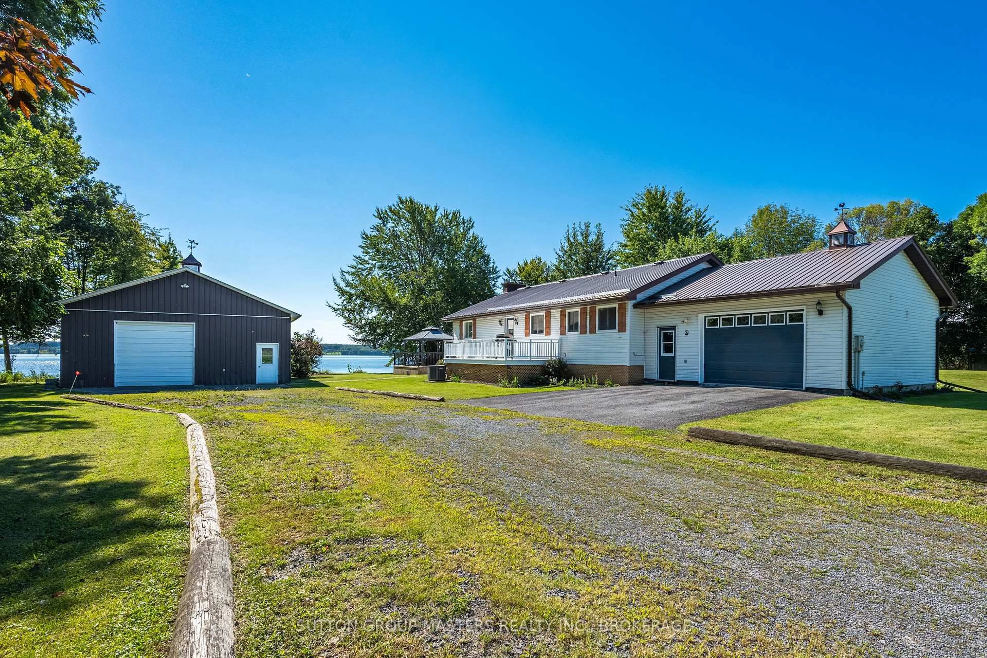A pic from outside/outdoor area/front of a property/back of a property/a pic from drone, unknown for 175 Pleasure Pt. Lane, Wolfe Island Ontario K0H 2Y0
