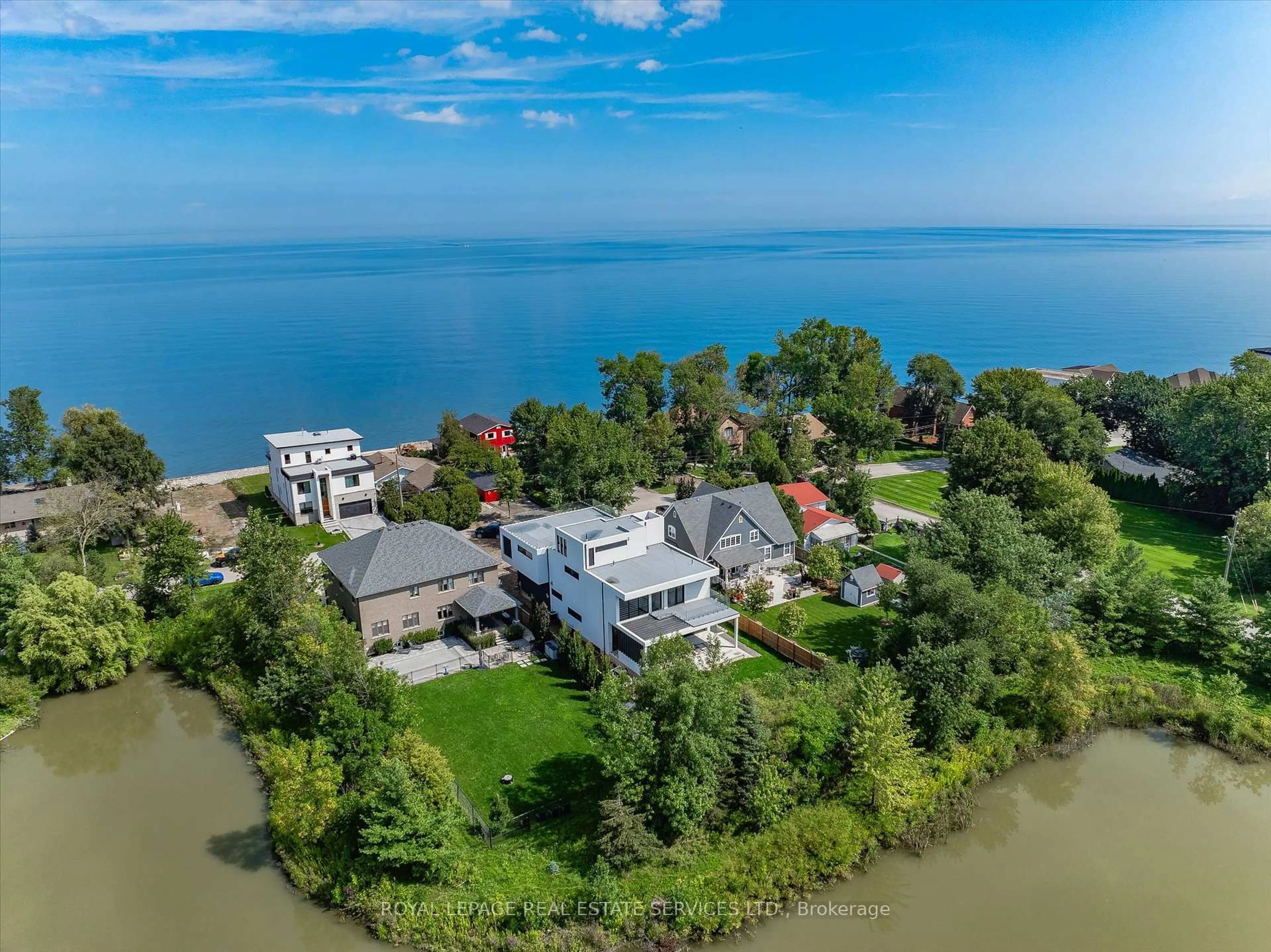 A pic from outside/outdoor area/front of a property/back of a property/a pic from drone, water/lake/river/ocean view for 36 Windemere Rd, Hamilton Ontario L8E 5G5