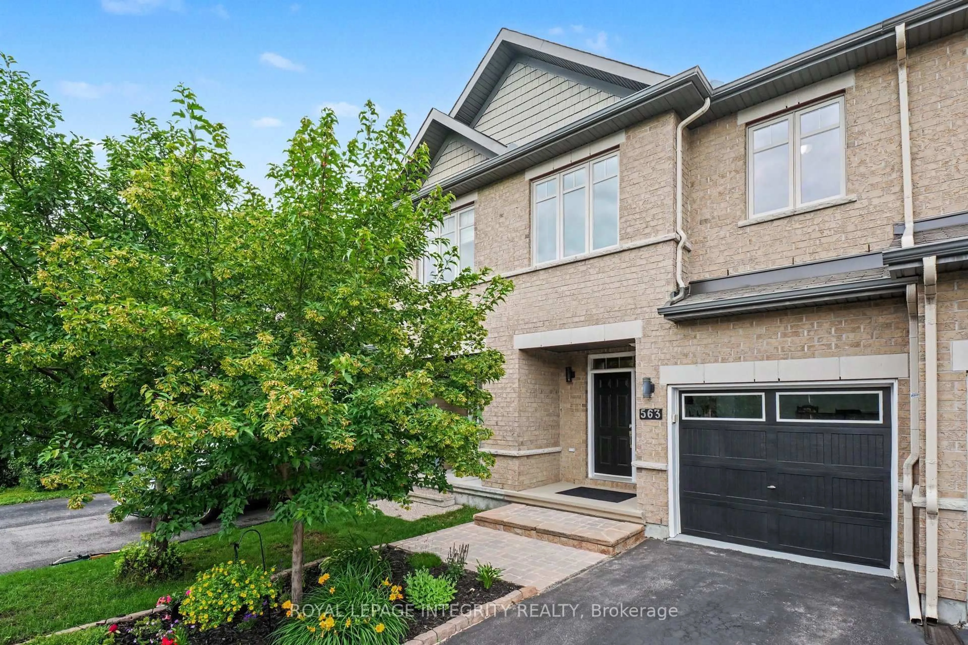 Home with brick exterior material, street for 563 Remnor Ave, Ottawa Ontario K2T 0A5