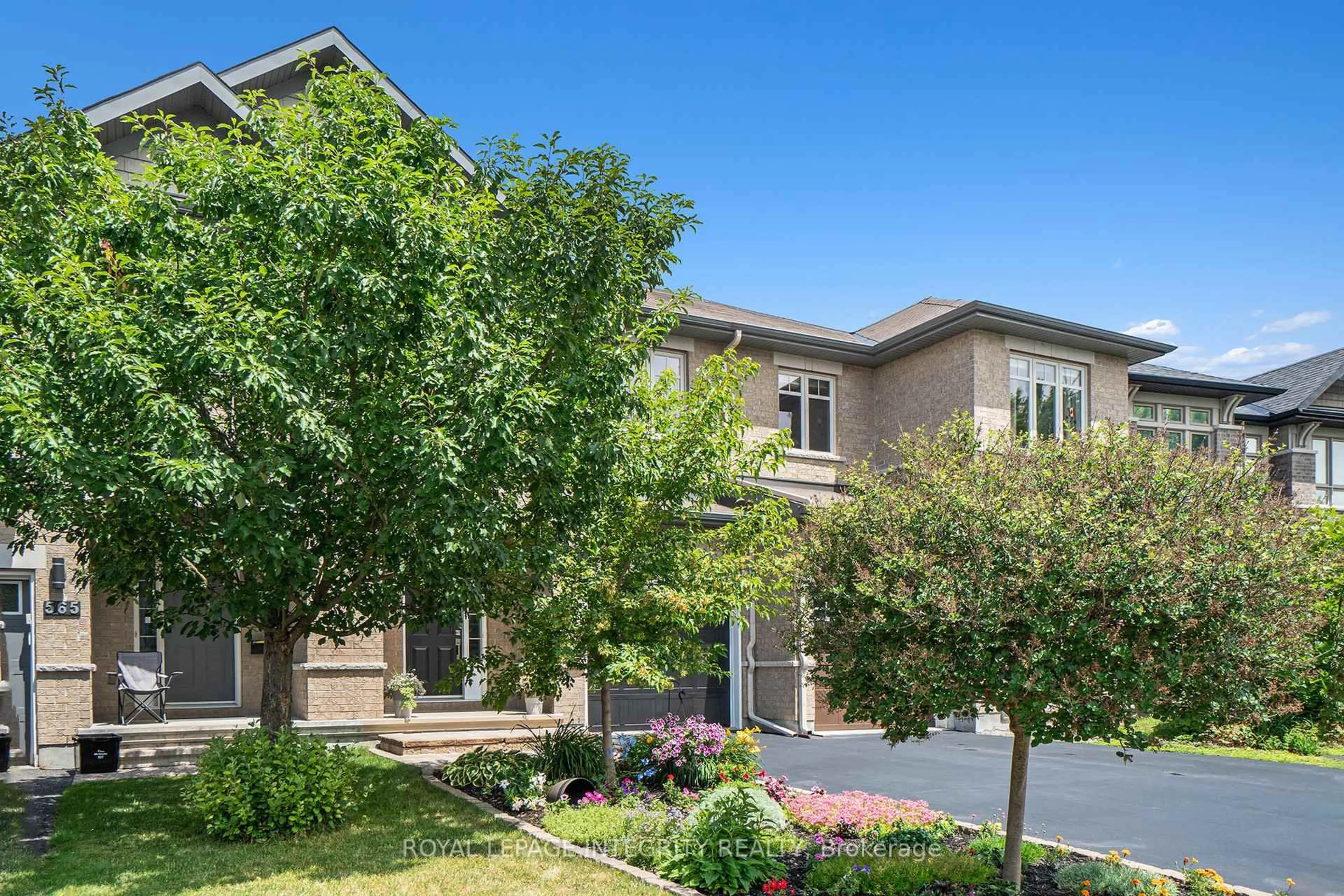 Home with brick exterior material, street for 563 Remnor Ave, Ottawa Ontario K2T 0A5