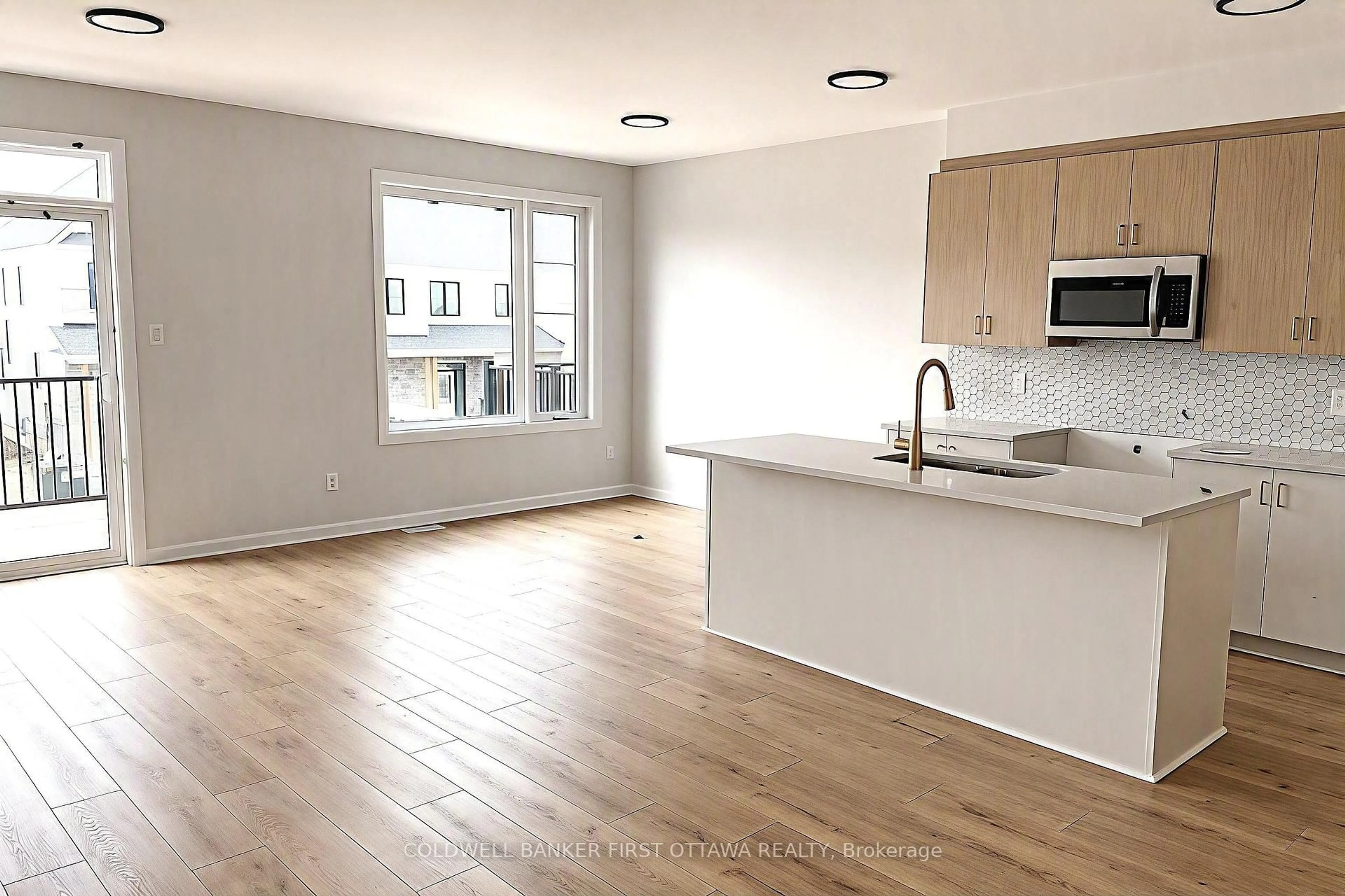 Open concept kitchen, wood/laminate floor for 738 Harold Mathie St, Almonte Ontario K0A 1A0