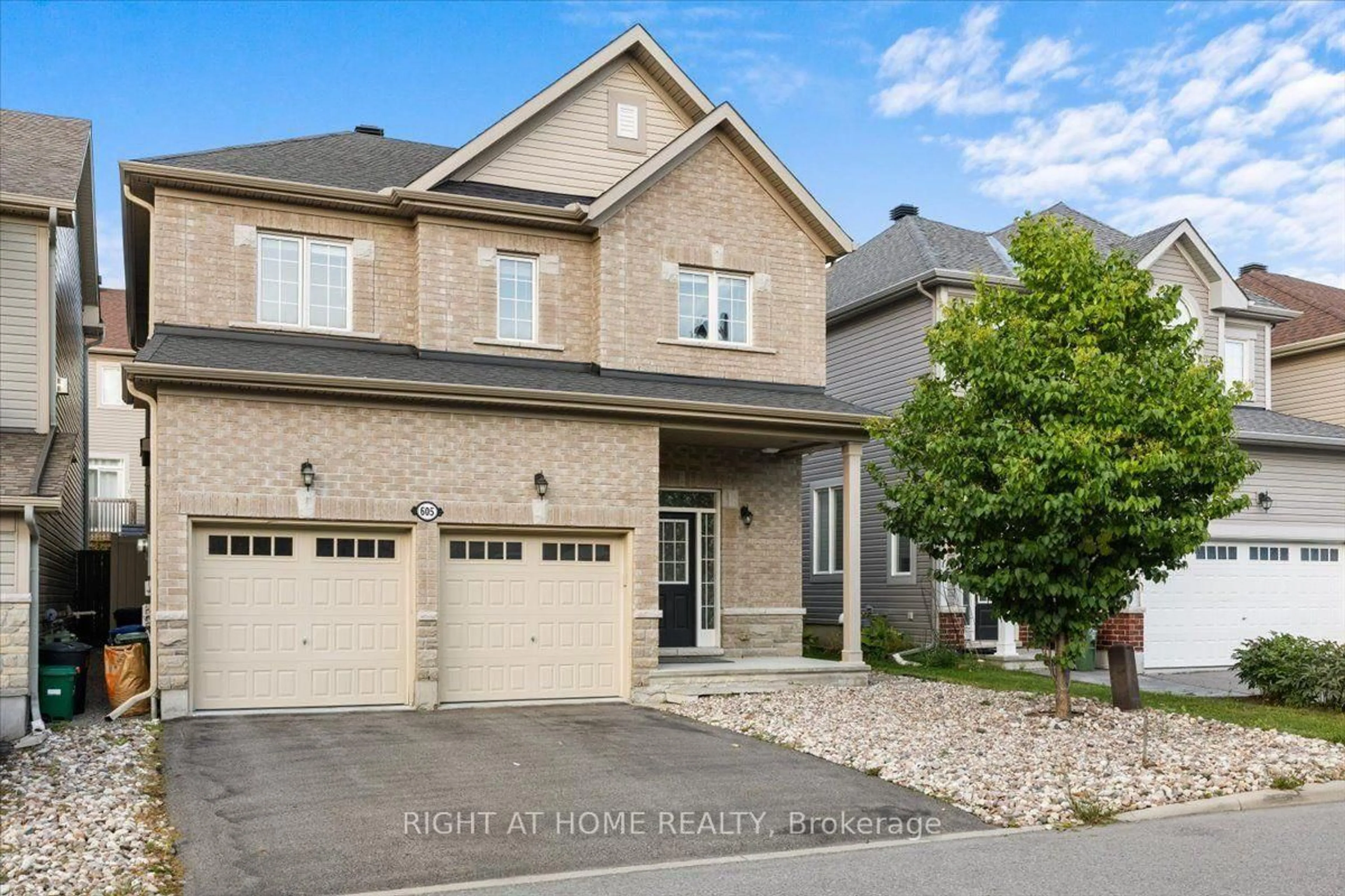 Home with brick exterior material, street for 605 Silver Spruce Way, Ottawa Ontario K2M 0L1