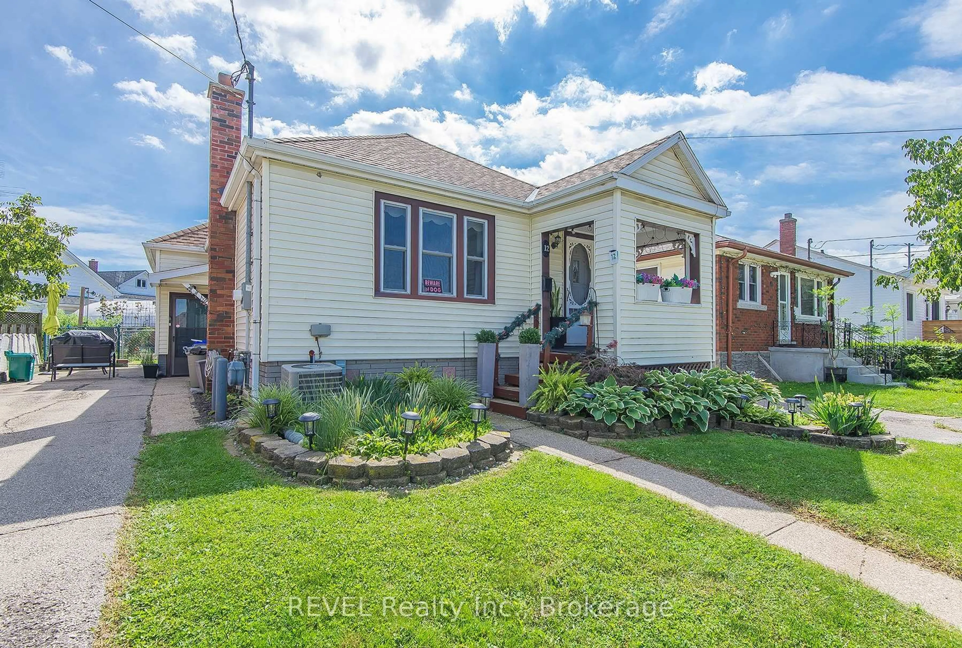 Home with brick exterior material, street for 12 Garnet St, St. Catharines Ontario L2M 5E5