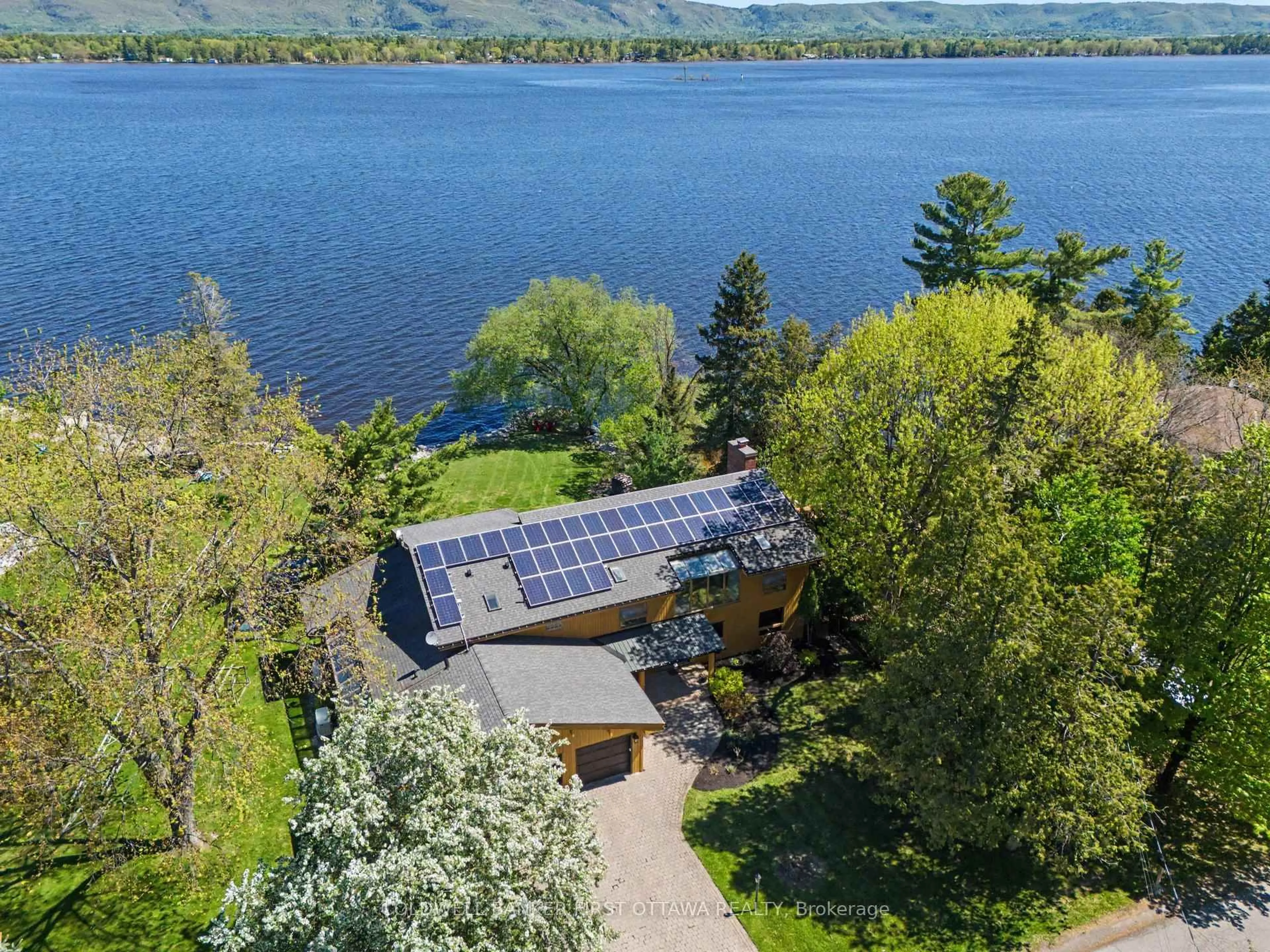 A pic from outside/outdoor area/front of a property/back of a property/a pic from drone, water/lake/river/ocean view for 3842 Armitage Ave, Ottawa Ontario K0A 1T0
