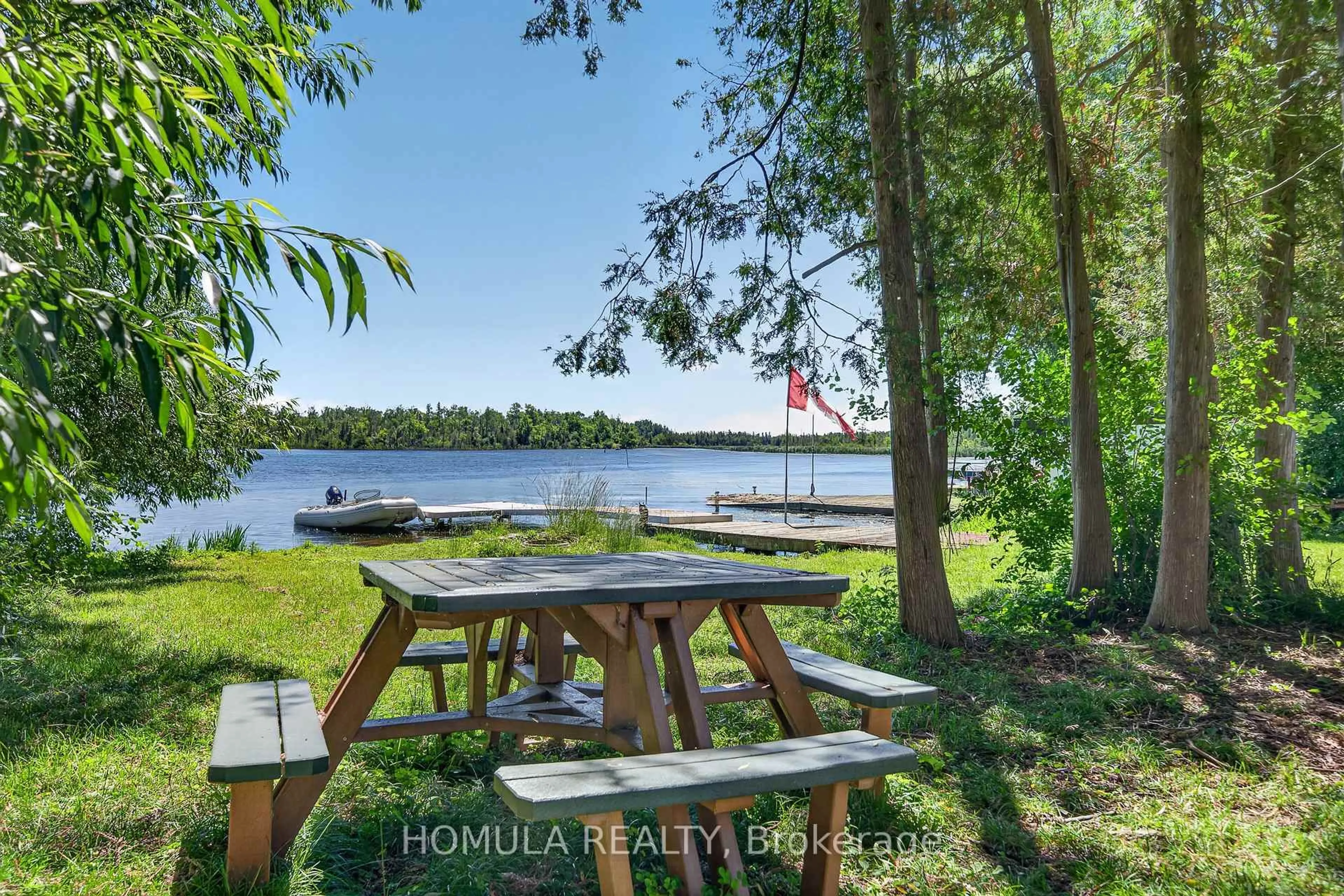A pic from outside/outdoor area/front of a property/back of a property/a pic from drone, water/lake/river/ocean view for 24 Riverside Dr, Kawartha Lakes Ontario K9V 0H6