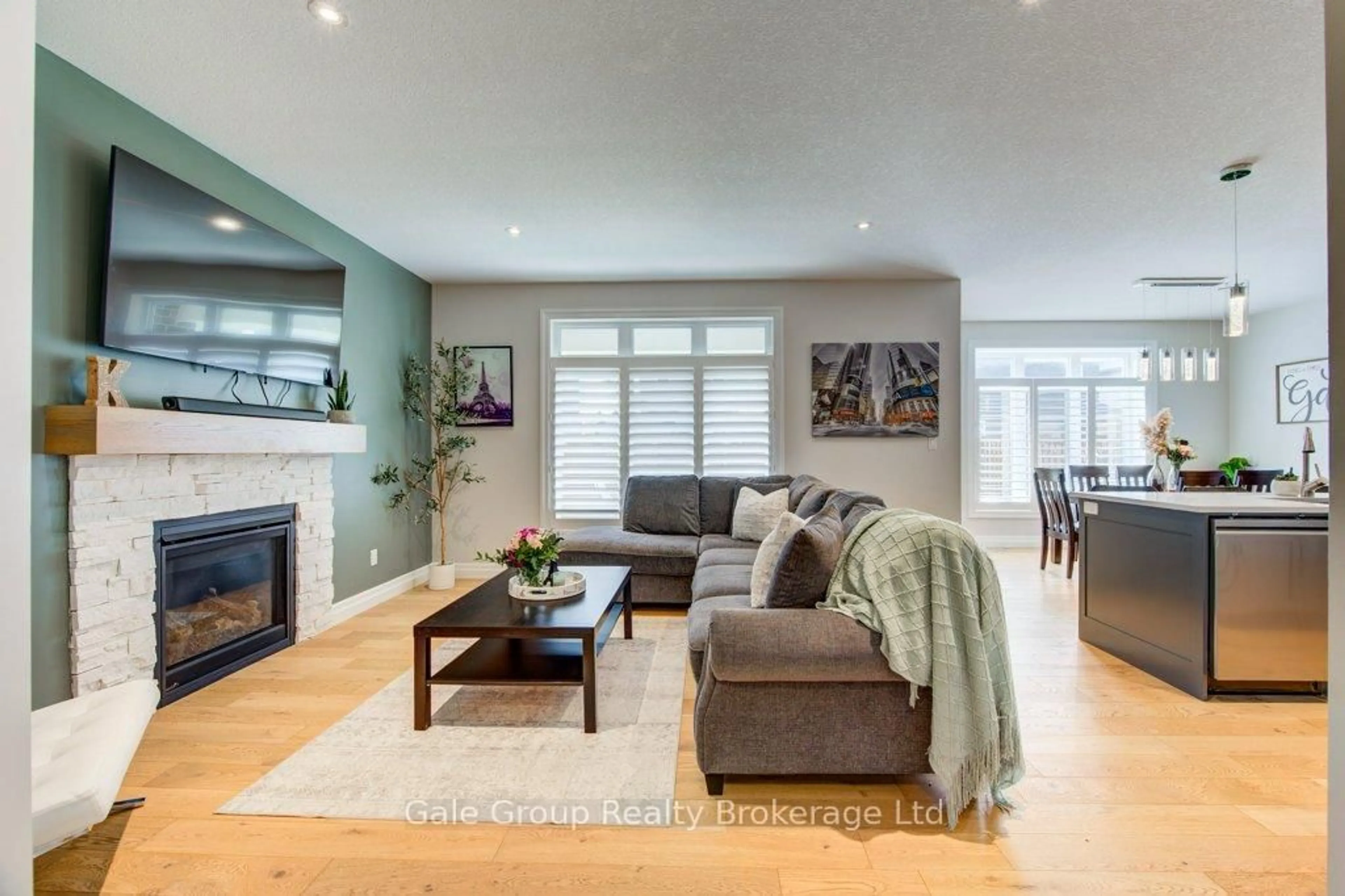 Living room with furniture, wood/laminate floor for 971 Downing Dr, Woodstock Ontario N4T 0K4
