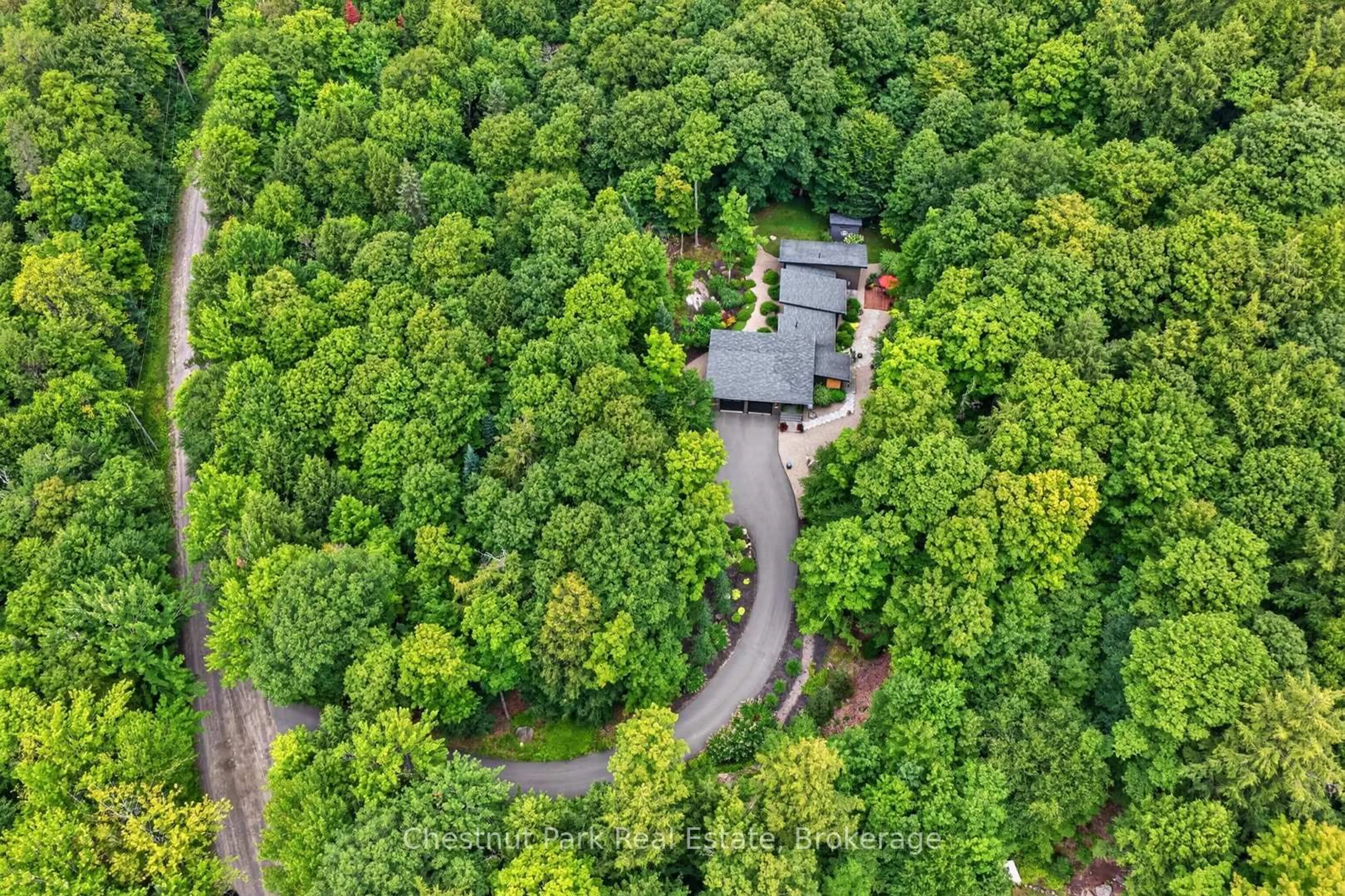 A pic from outside/outdoor area/front of a property/back of a property/a pic from drone, forest/trees view for 115 Lindgren Rd, Huntsville Ontario P1H 1Y6