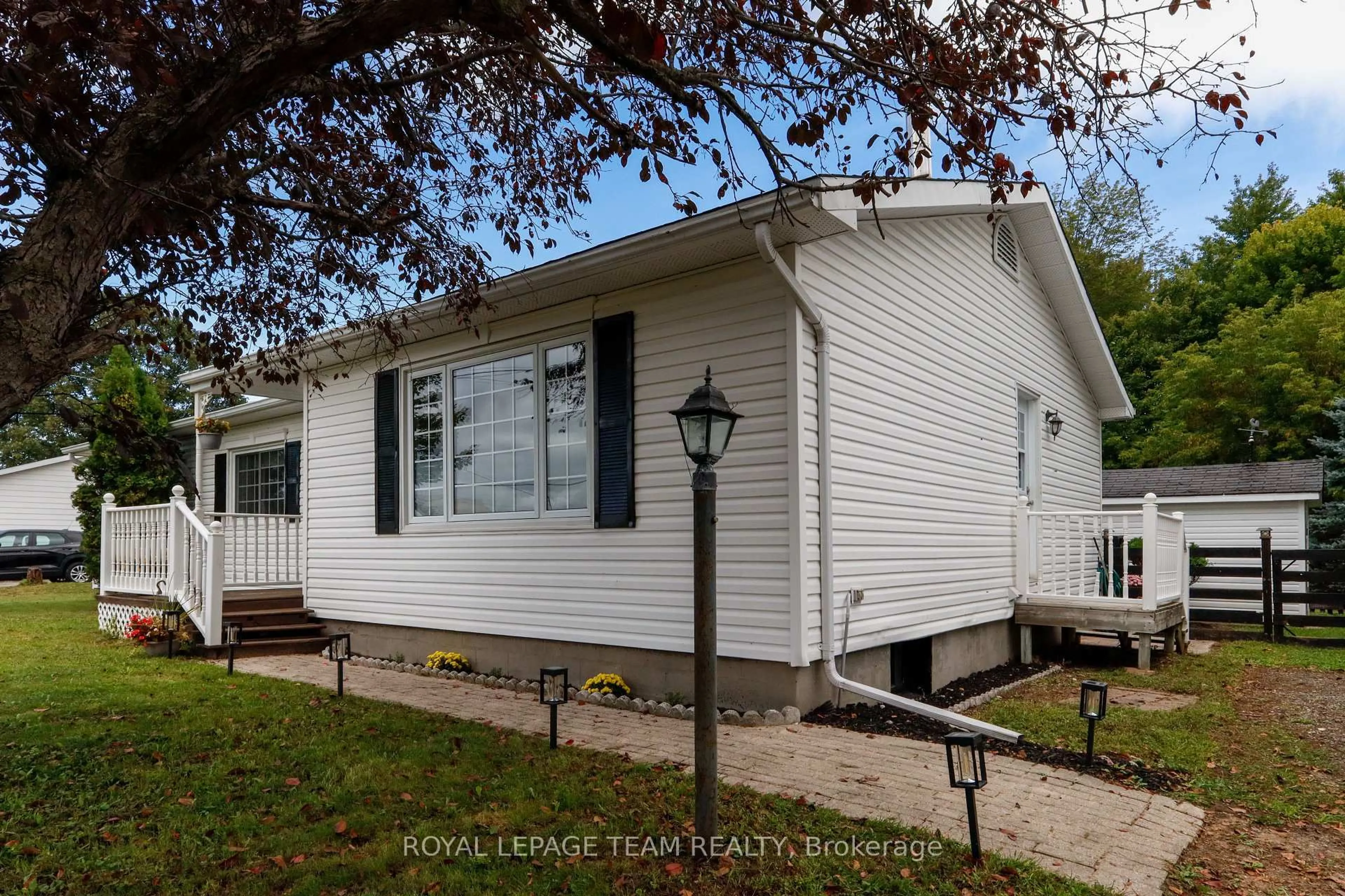Home with vinyl exterior material, street for 5765 Rideau River Rd Rd, North Grenville Ontario K0G 1J0