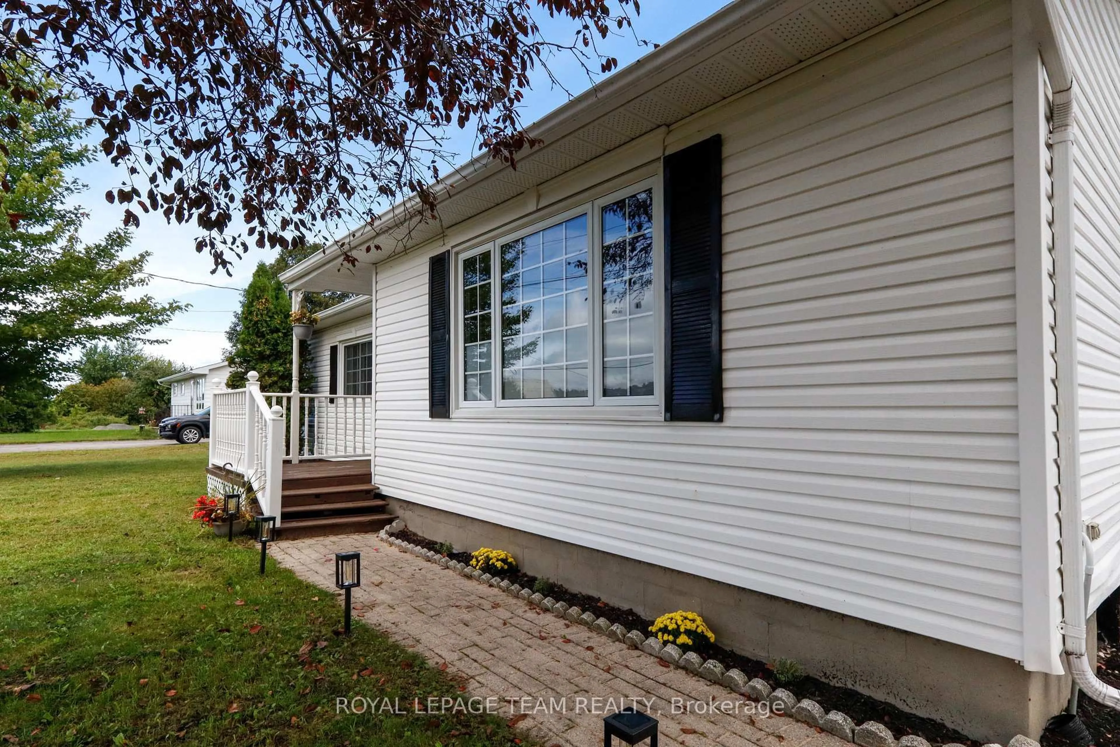 Home with vinyl exterior material, street for 5765 Rideau River Rd Rd, North Grenville Ontario K0G 1J0