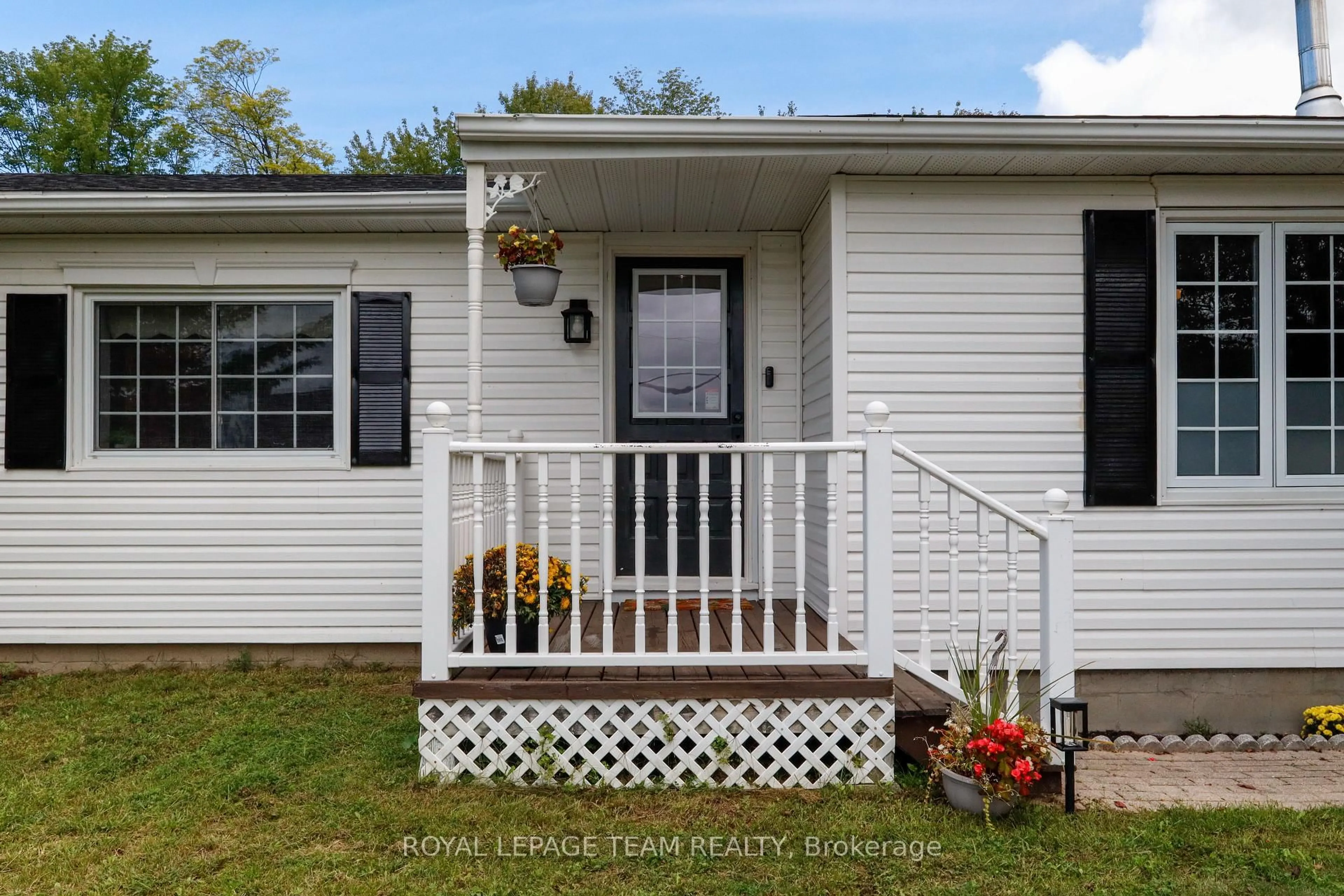 Home with vinyl exterior material, street for 5765 Rideau River Rd Rd, North Grenville Ontario K0G 1J0