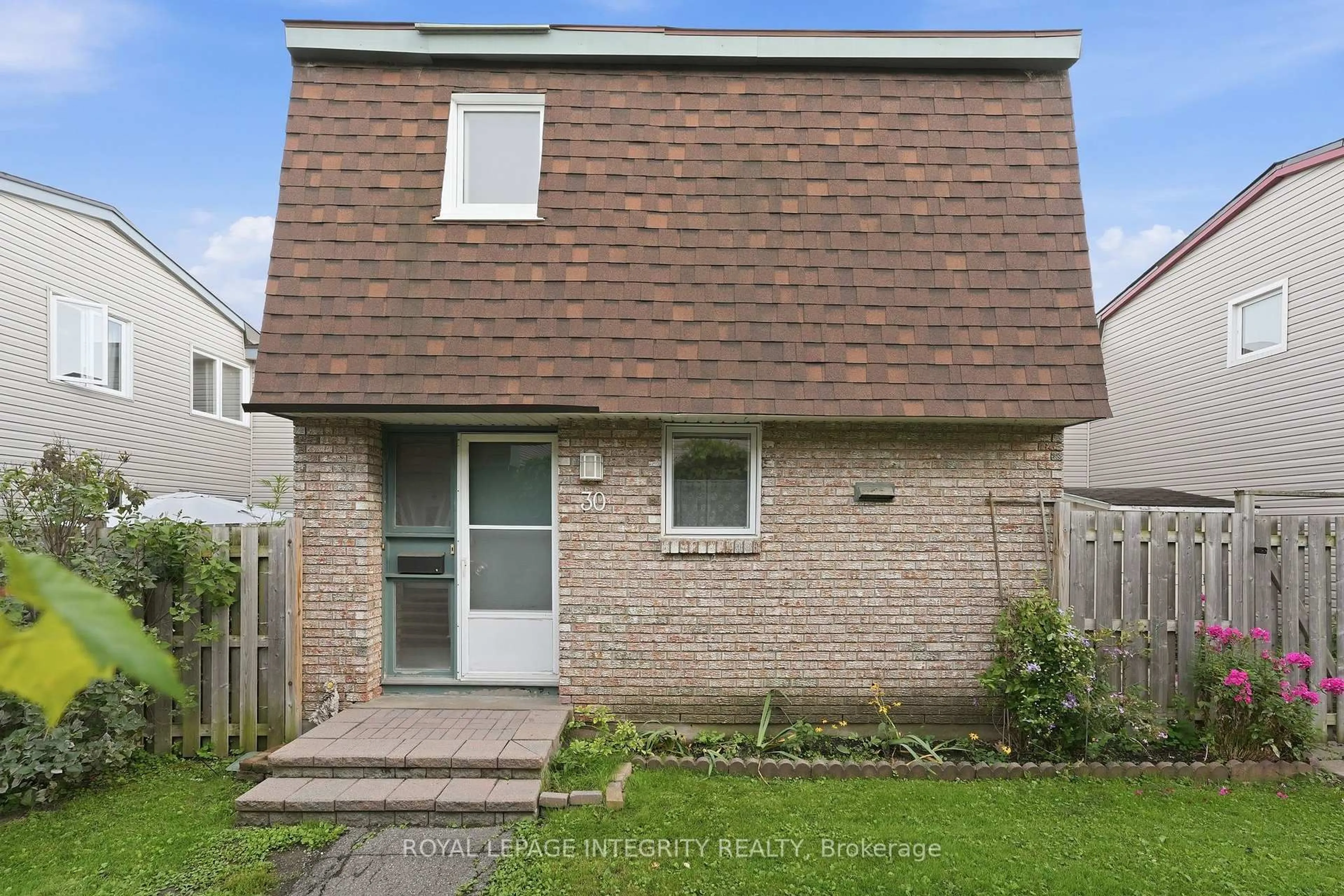 Home with brick exterior material, street for 2057 Jasmine Cres #30, Ottawa Ontario K1J 7W2