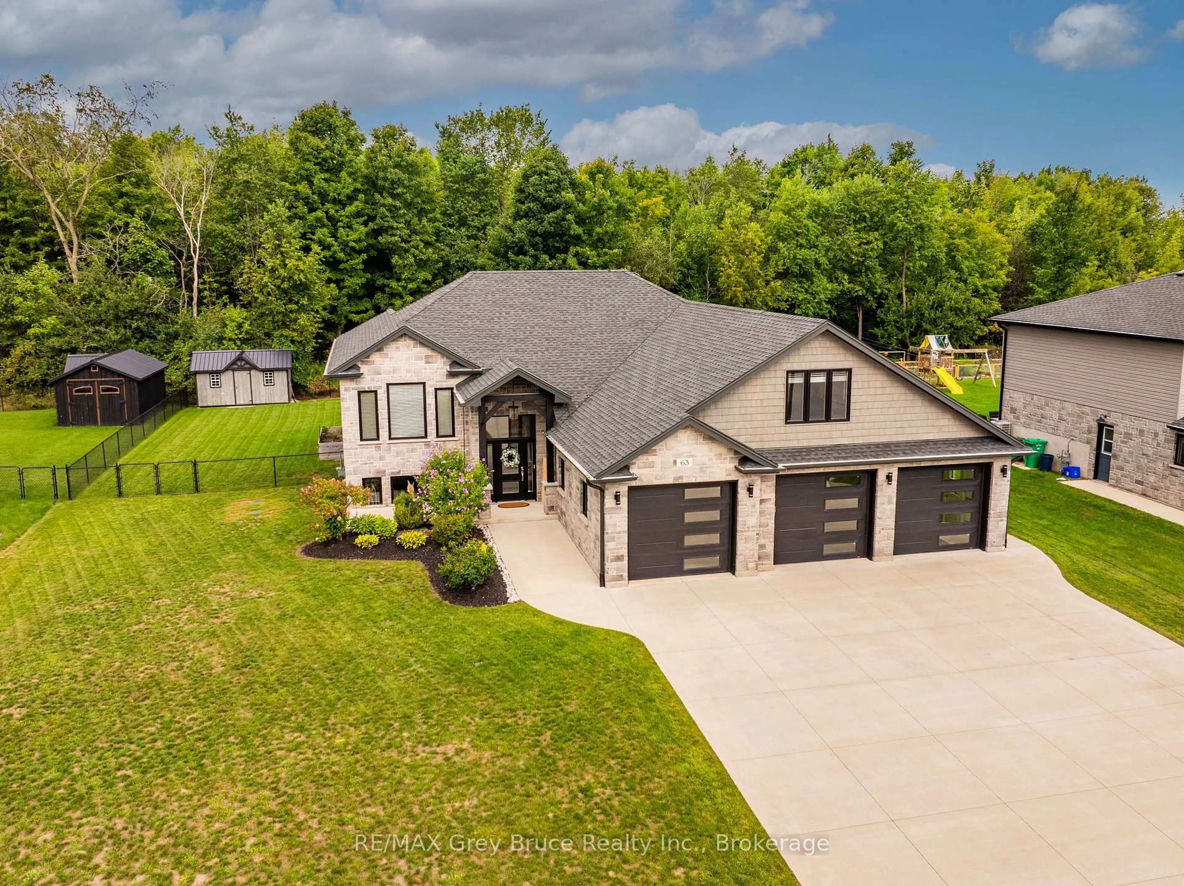 A pic from outside/outdoor area/front of a property/back of a property/a pic from drone, unknown for 63 Howe Dr, Georgian Bluffs Ontario N0H 2K0