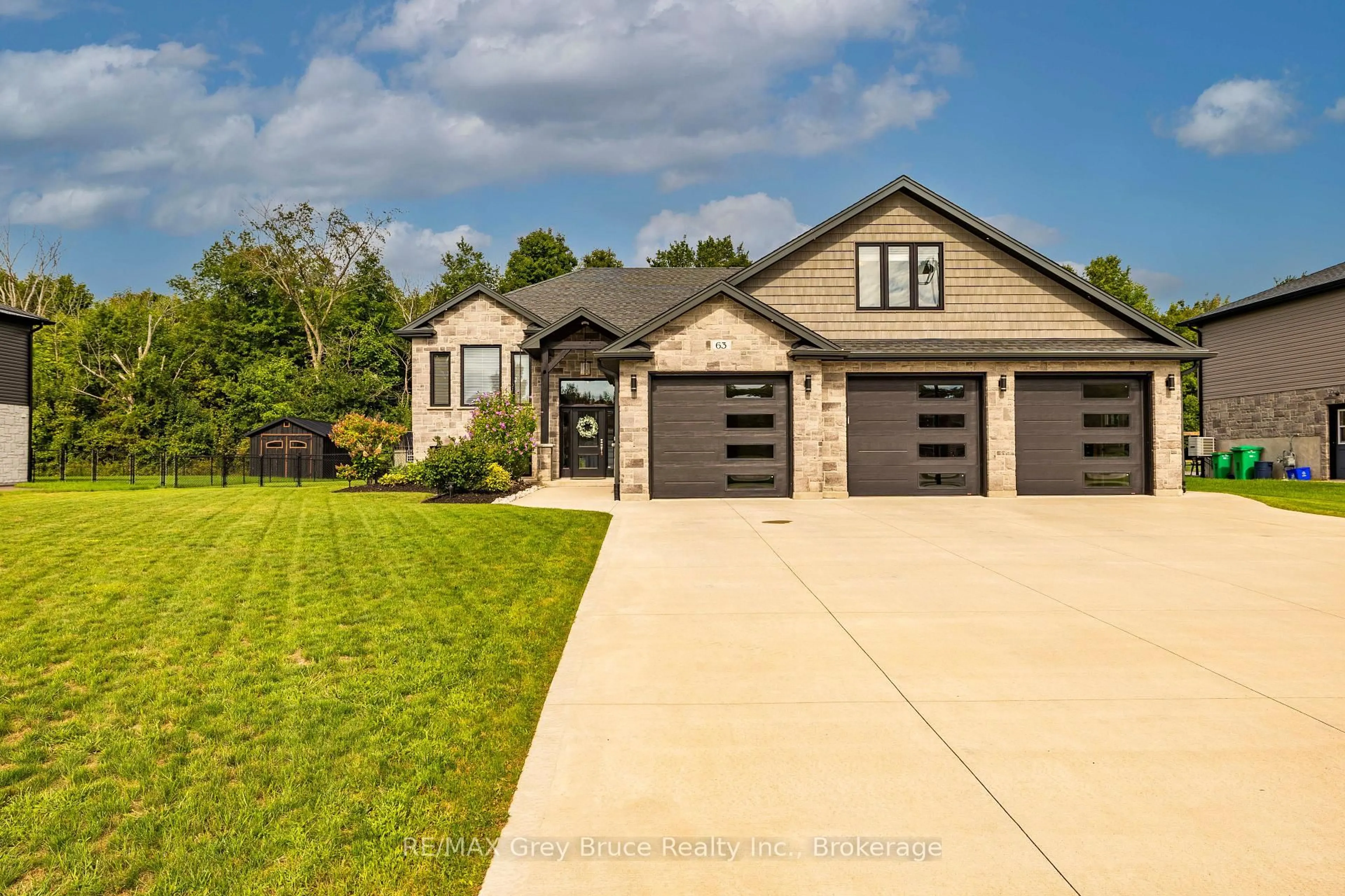 Home with brick exterior material, street for 63 Howe Dr, Georgian Bluffs Ontario N0H 2K0