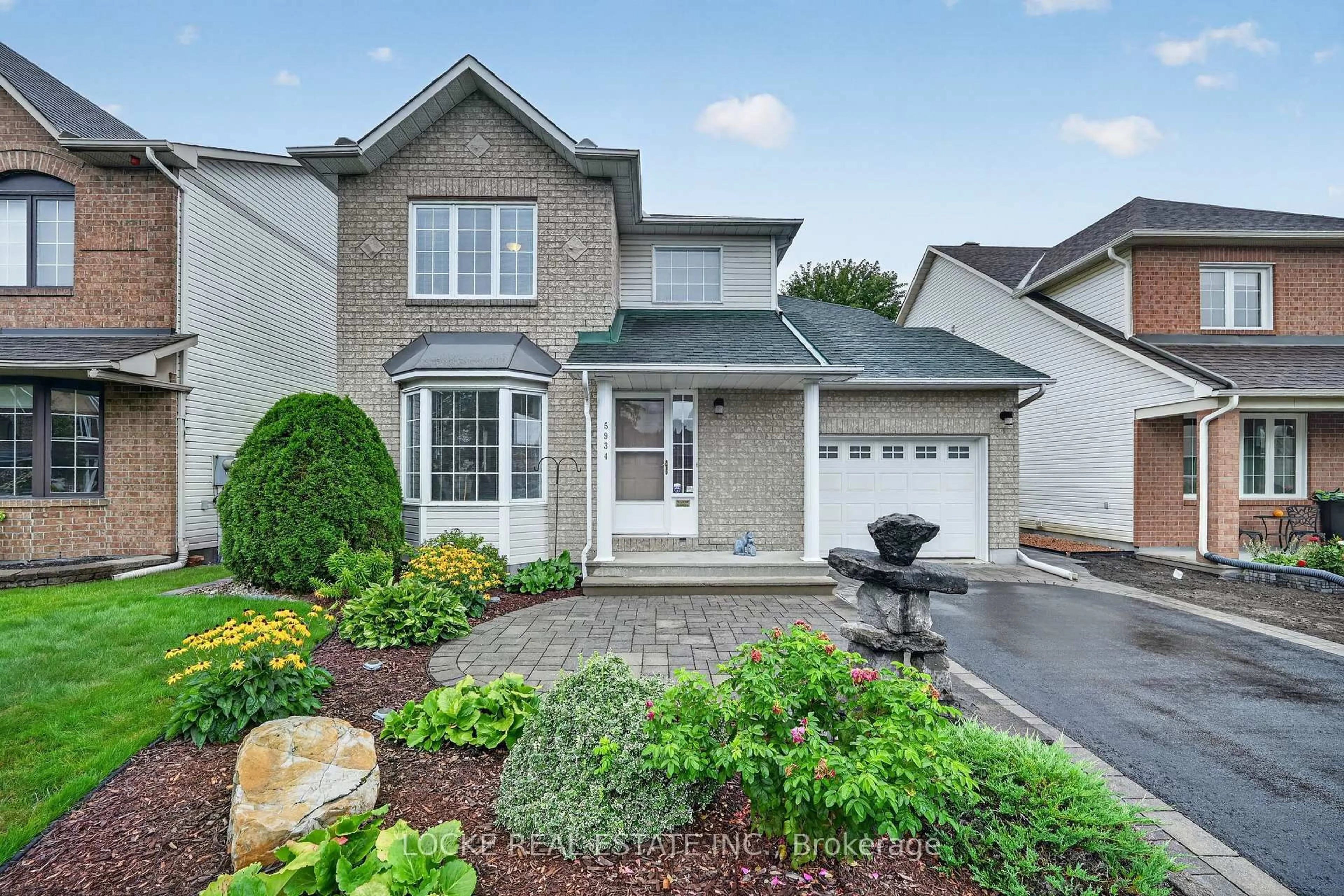 Home with vinyl exterior material, street for 5934 Gladewoods Pl, Ottawa Ontario K1W 1G5