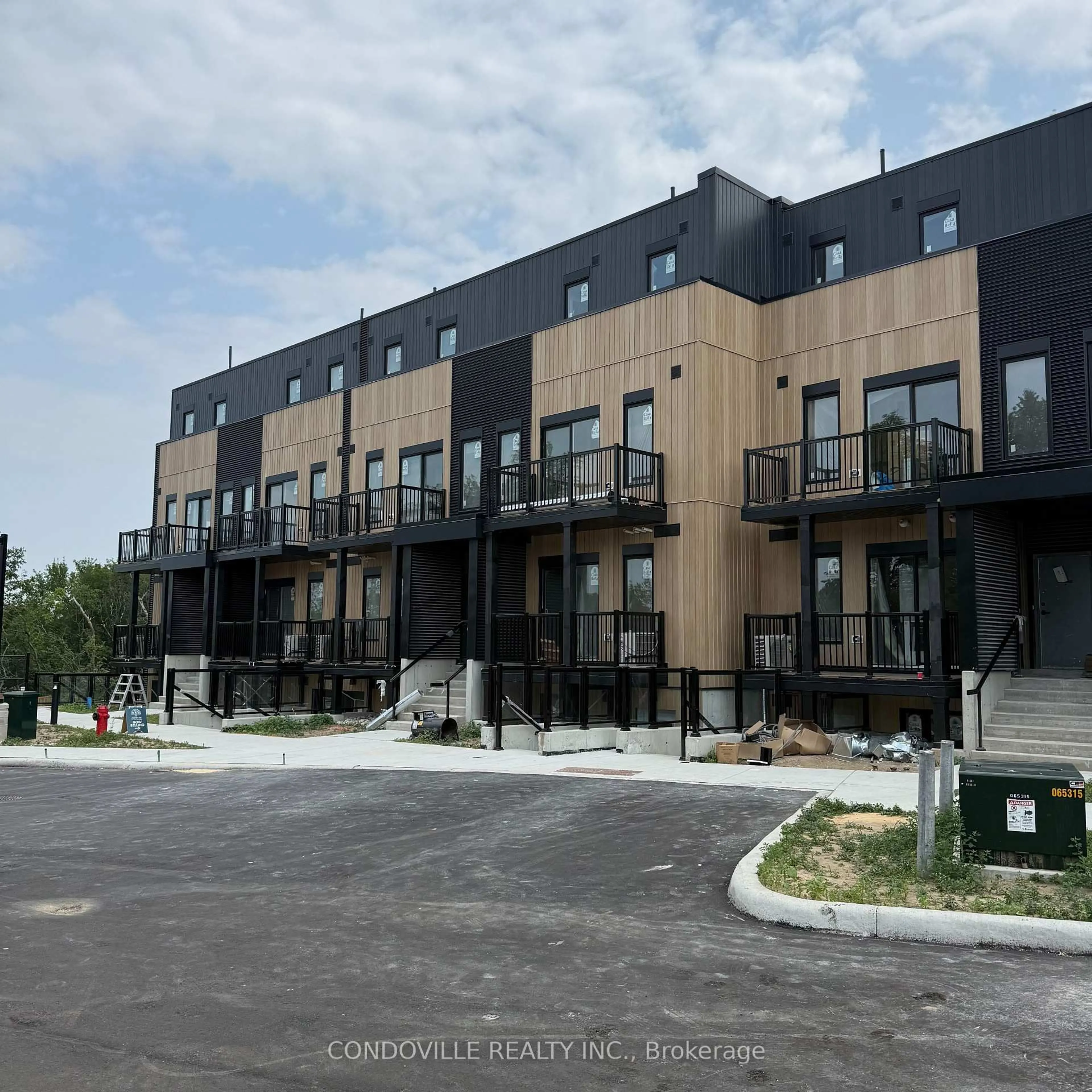 A pic from outside/outdoor area/front of a property/back of a property/a pic from drone, street for 854 Doon Village Rd #3, Kitchener Ontario N2P 1A3