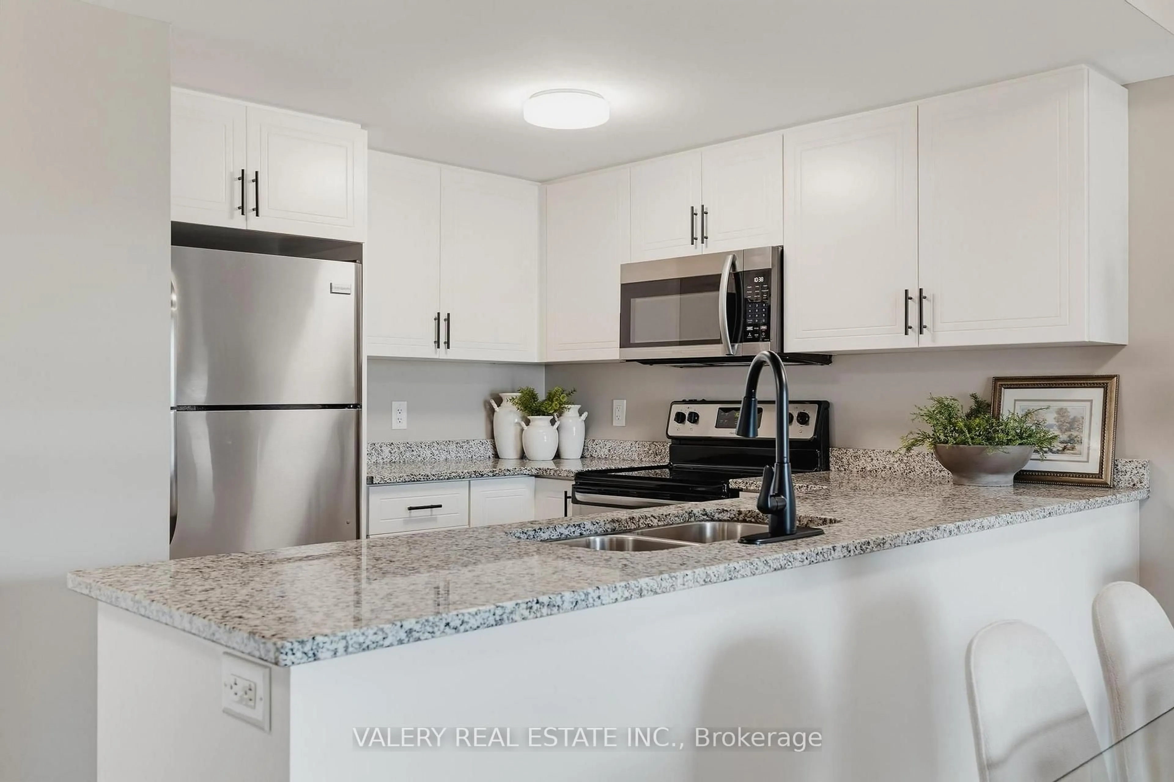 Standard kitchen, ceramic/tile floor for 155 Commonwealth St #207, Kitchener Ontario N2E 0G5