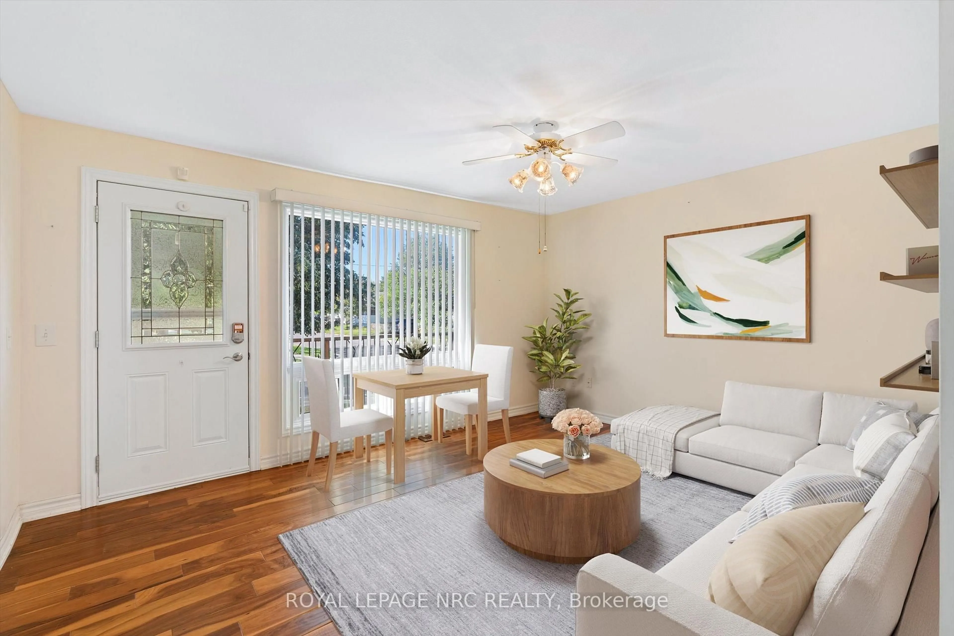 Living room with furniture, wood/laminate floor for 370 Dieppe St, Welland Ontario L3B 4V4
