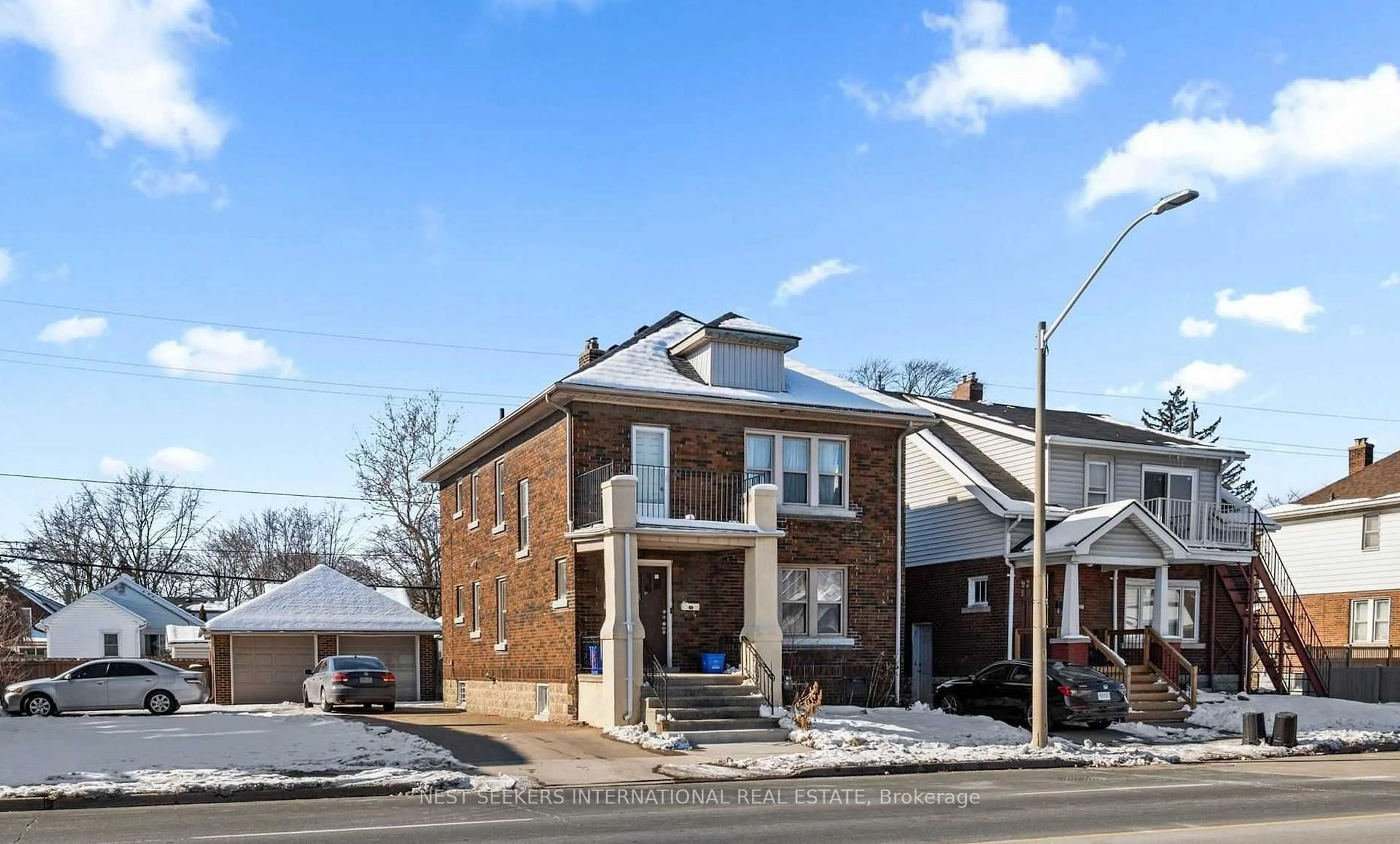 Home with brick exterior material, street for 2257-59 Howard Ave, Windsor Ontario N8X 3V2