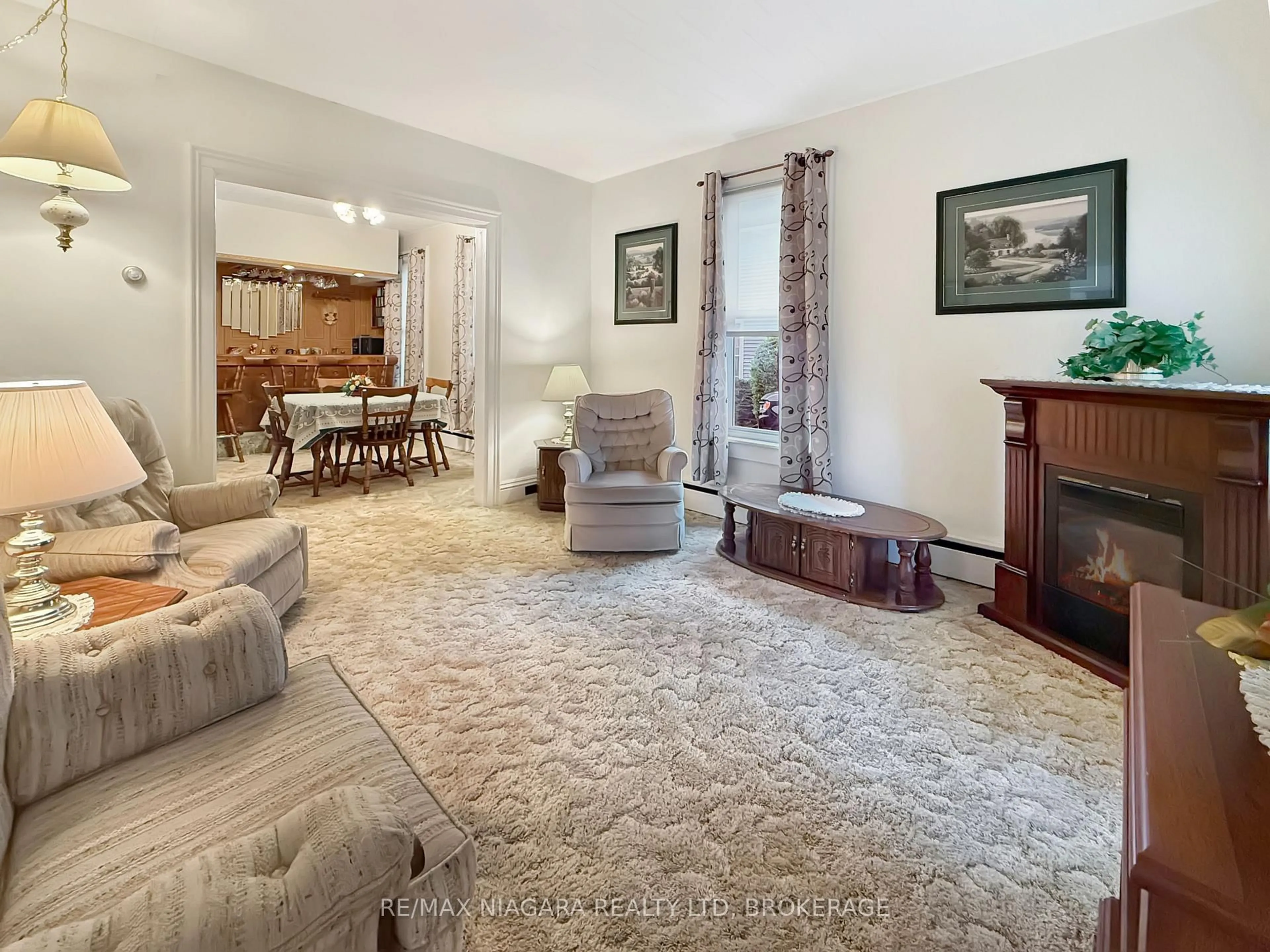 Living room with furniture, carpet floor for 358 Phipps St, Fort Erie Ontario L2A 2V8