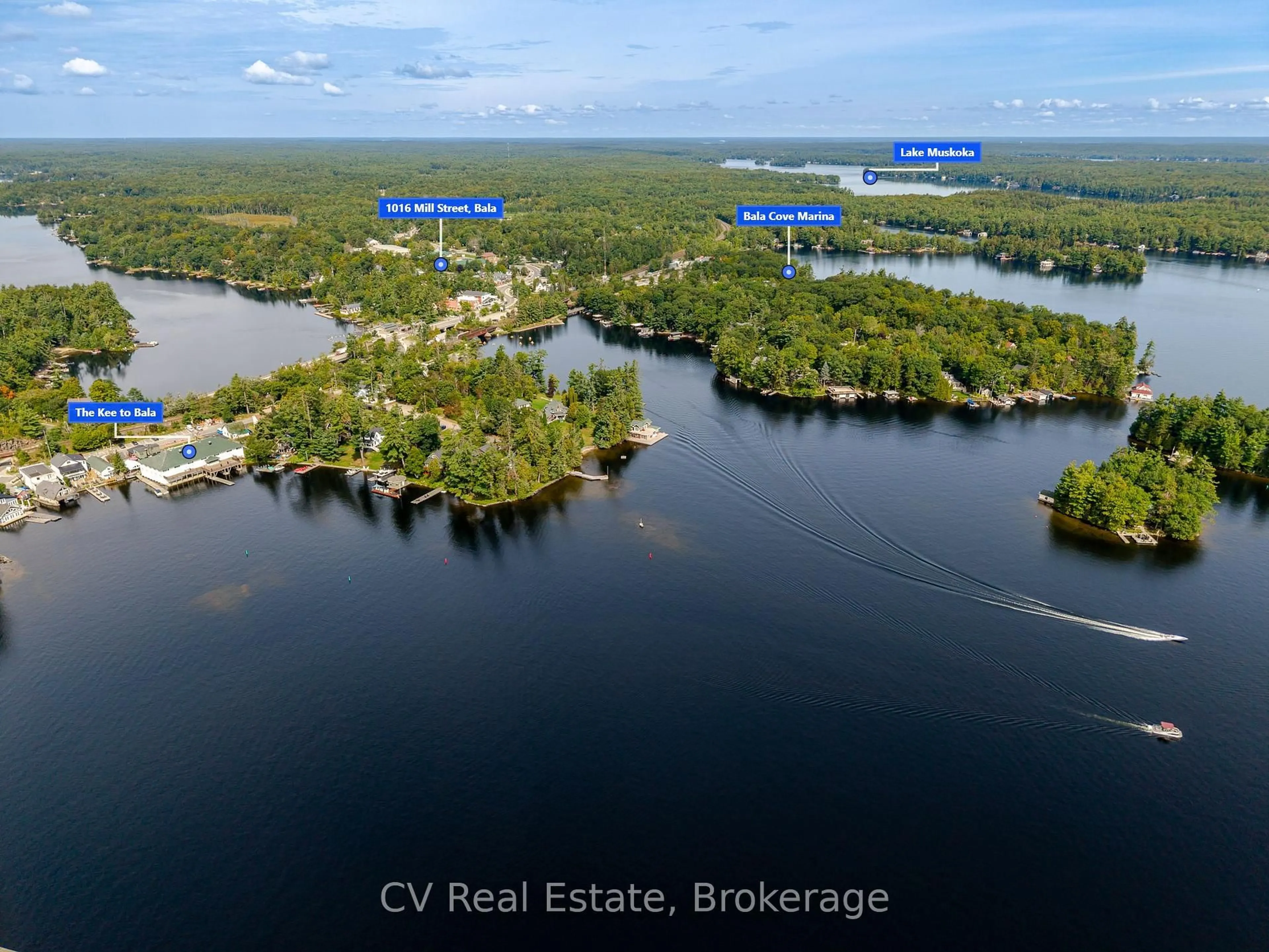 A pic from outside/outdoor area/front of a property/back of a property/a pic from drone, water/lake/river/ocean view for 1016 Mill St, Muskoka Lakes Ontario P0C 1A0