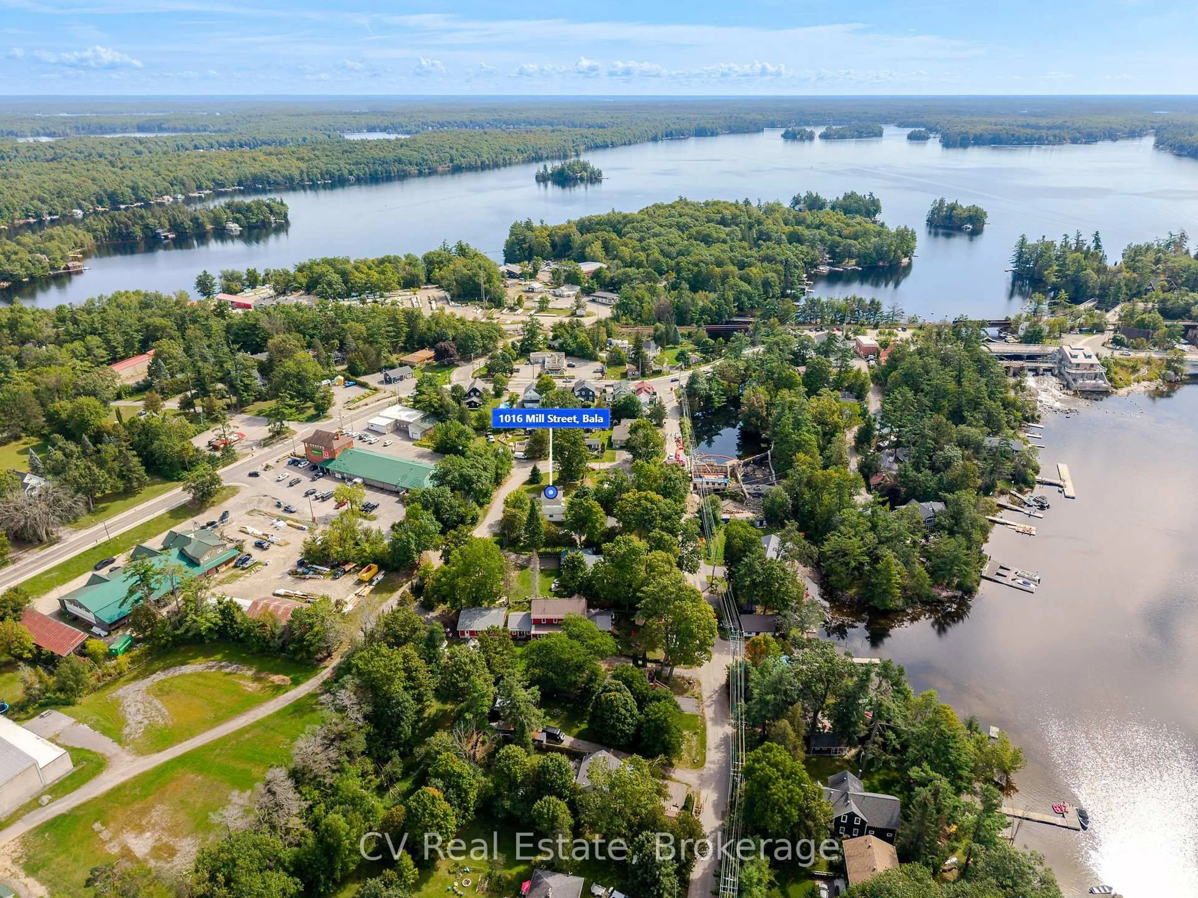 A pic from outside/outdoor area/front of a property/back of a property/a pic from drone, water/lake/river/ocean view for 1016 Mill St, Muskoka Lakes Ontario P0C 1A0