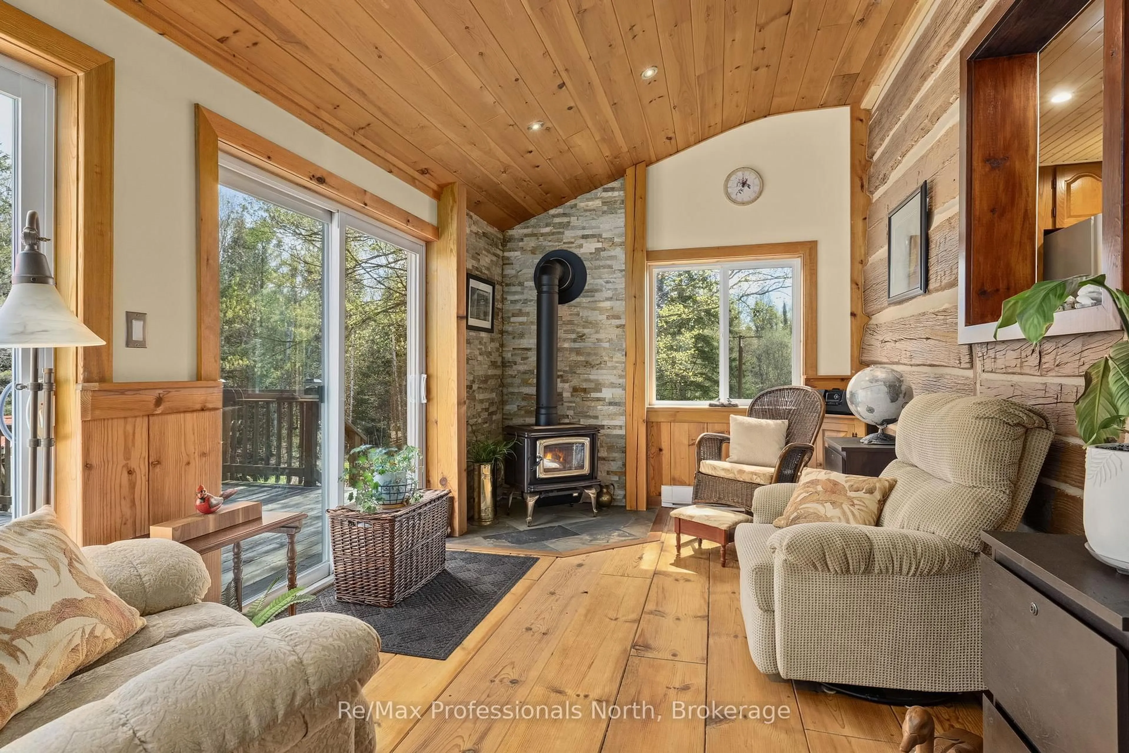 Living room with furniture, wood/laminate floor for 3569 Chetwynd Rd, Kearney Ontario P0A 1M0