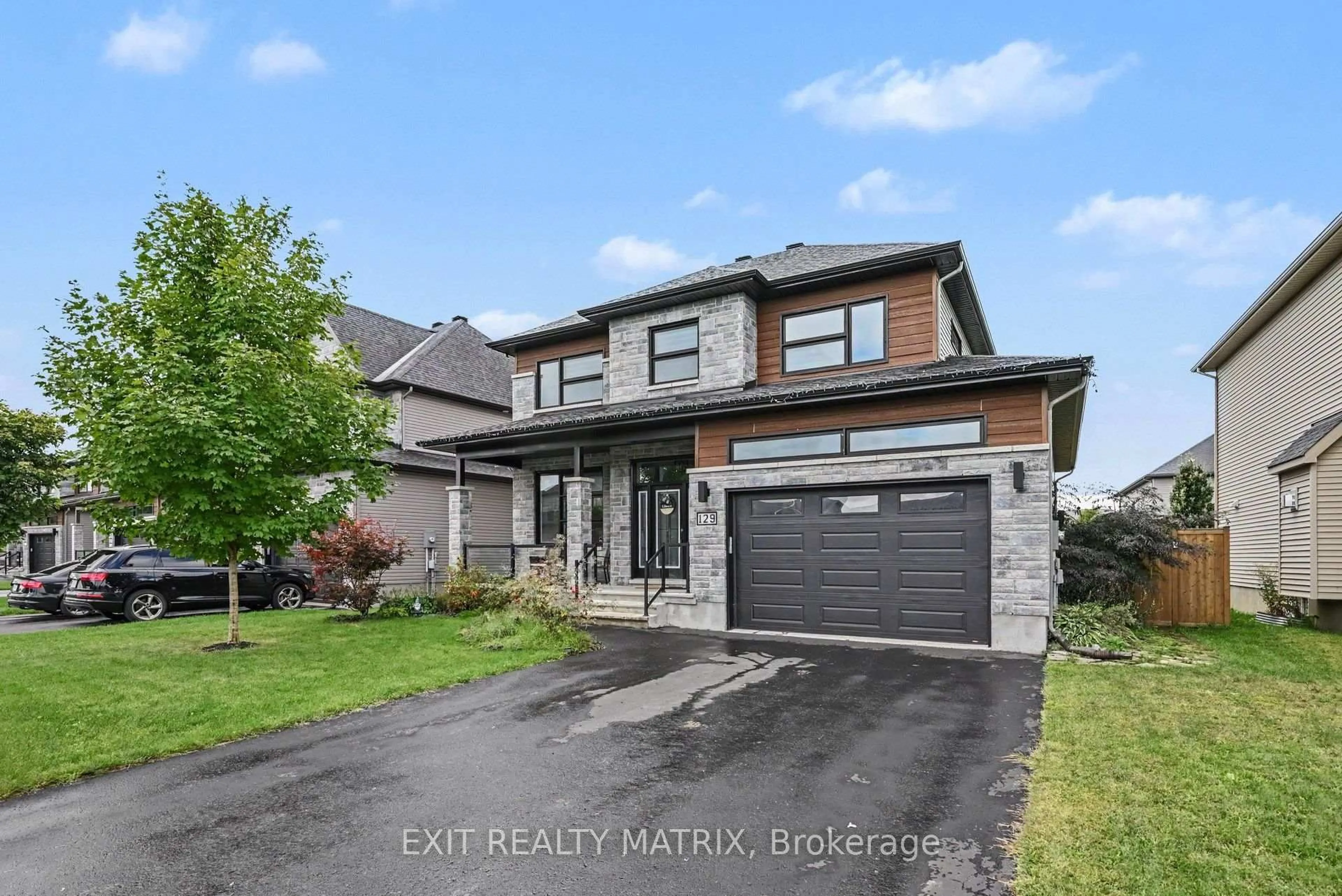 Home with brick exterior material, street for 129 Lyon St, Russell Ontario K0A 1W0