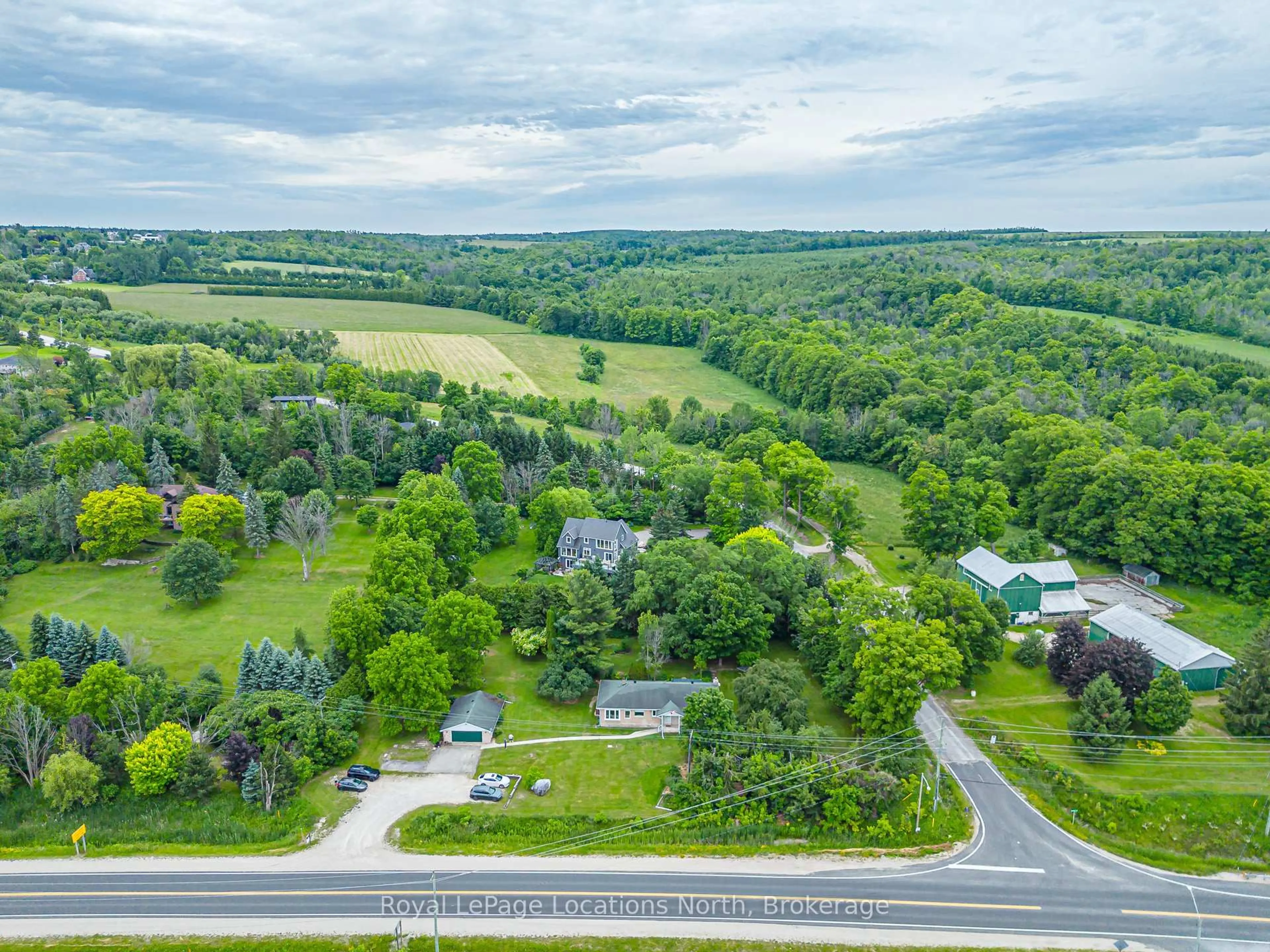 A pic from outside/outdoor area/front of a property/back of a property/a pic from drone, forest/trees view for 206720 Highway 26, Meaford Ontario N4L 1W7